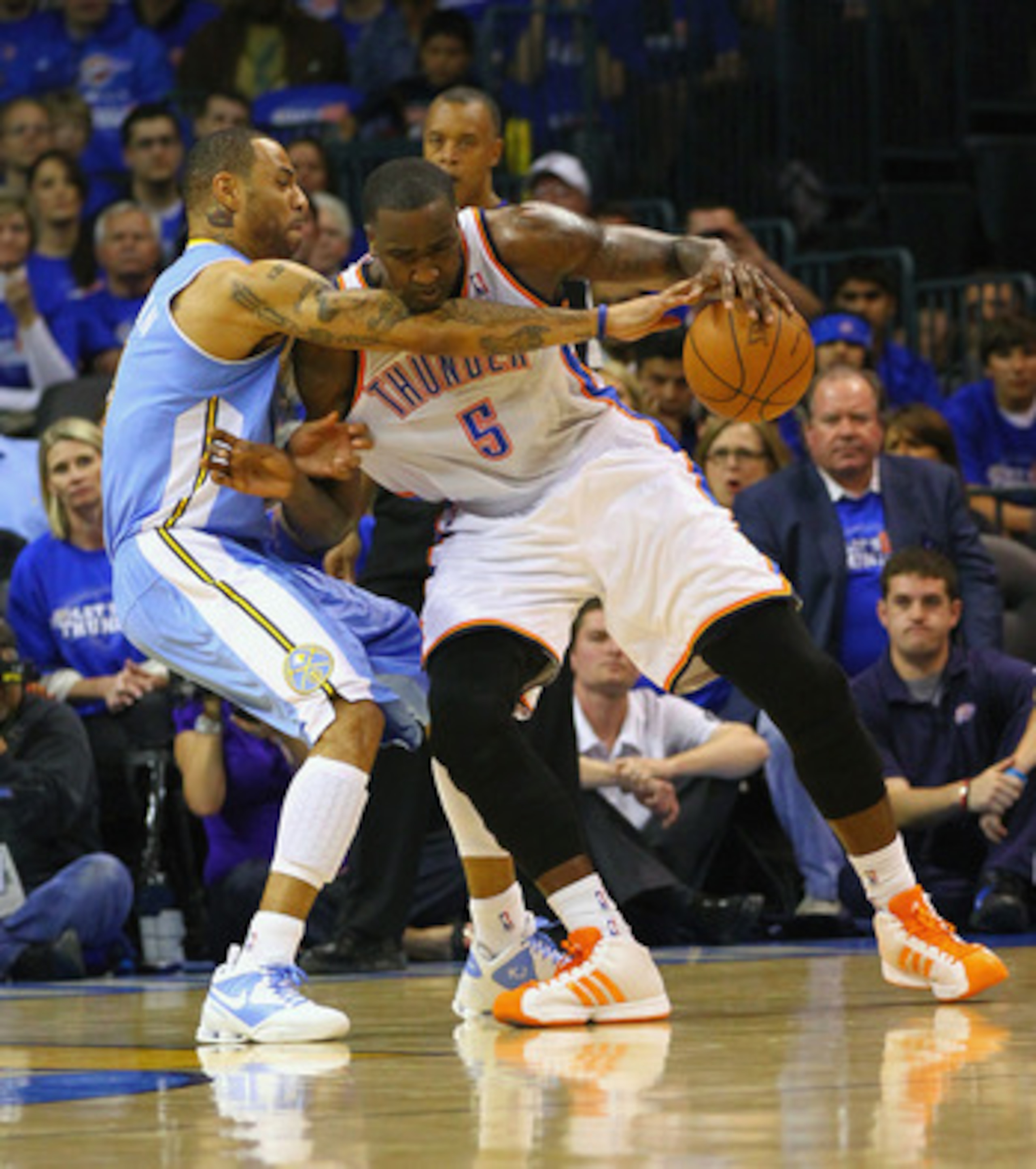 OKLAHOMA CITY, OK - APRIL 20: Kenyon Martin #4 of the Denver Nuggets defends against Kendrick Perkins #5 of the Oklahoma City Thunder in Game Two of the Western Conference Quarterfinals in the 2011 NBA Playoffs on April 20, 2011 at the Ford Center in Okla OKLAHOMA CITY, OK - APRIL 20: Kenyon Martin #4 of the Denver Nuggets defends against Kendrick Perkins #5 of the Oklahoma City Thunder in Game Two of the Western Conference Quarterfinals in the 2011 NBA Playoffs on April 20, 2011 at the Ford Center in Okla