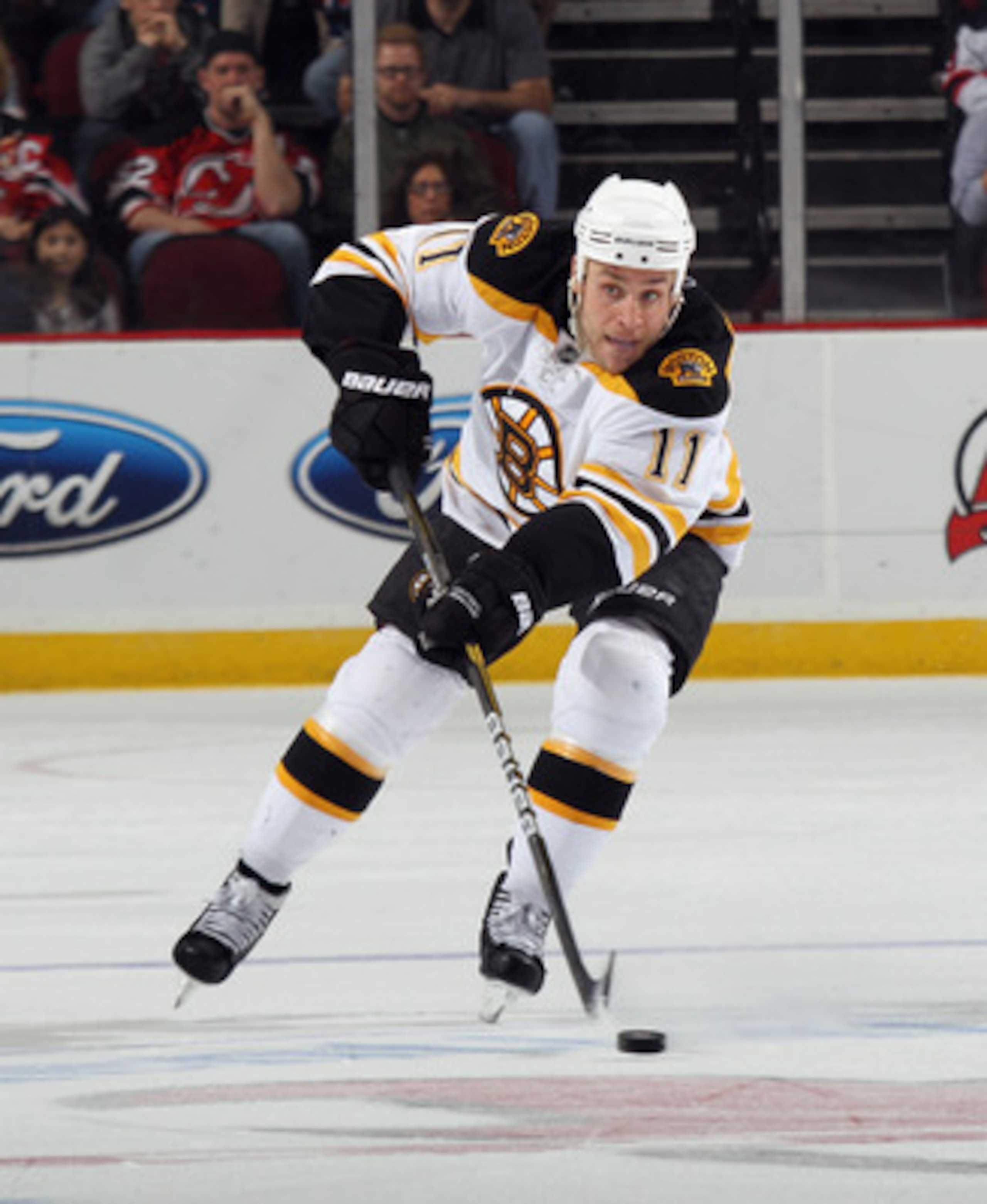 NEWARK, NJ - APRIL 10: Gregory Campbell #11 of the Boston Bruins skates against the New Jersey Devils at the Prudential Center on April 10, 2011 in Newark, New Jersey.  (Photo by Bruce Bennett/Getty Images)