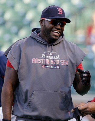BALTIMORE, MD - APRIL 26: David Ortiz #34 (L) and Carl Crawford #13 of the Boston Red Sox (R) share a laugh while waiting to take batting practice before the the start of their game against the Baltimore Orioles at Oriole Park at Camden Yards on April 26,