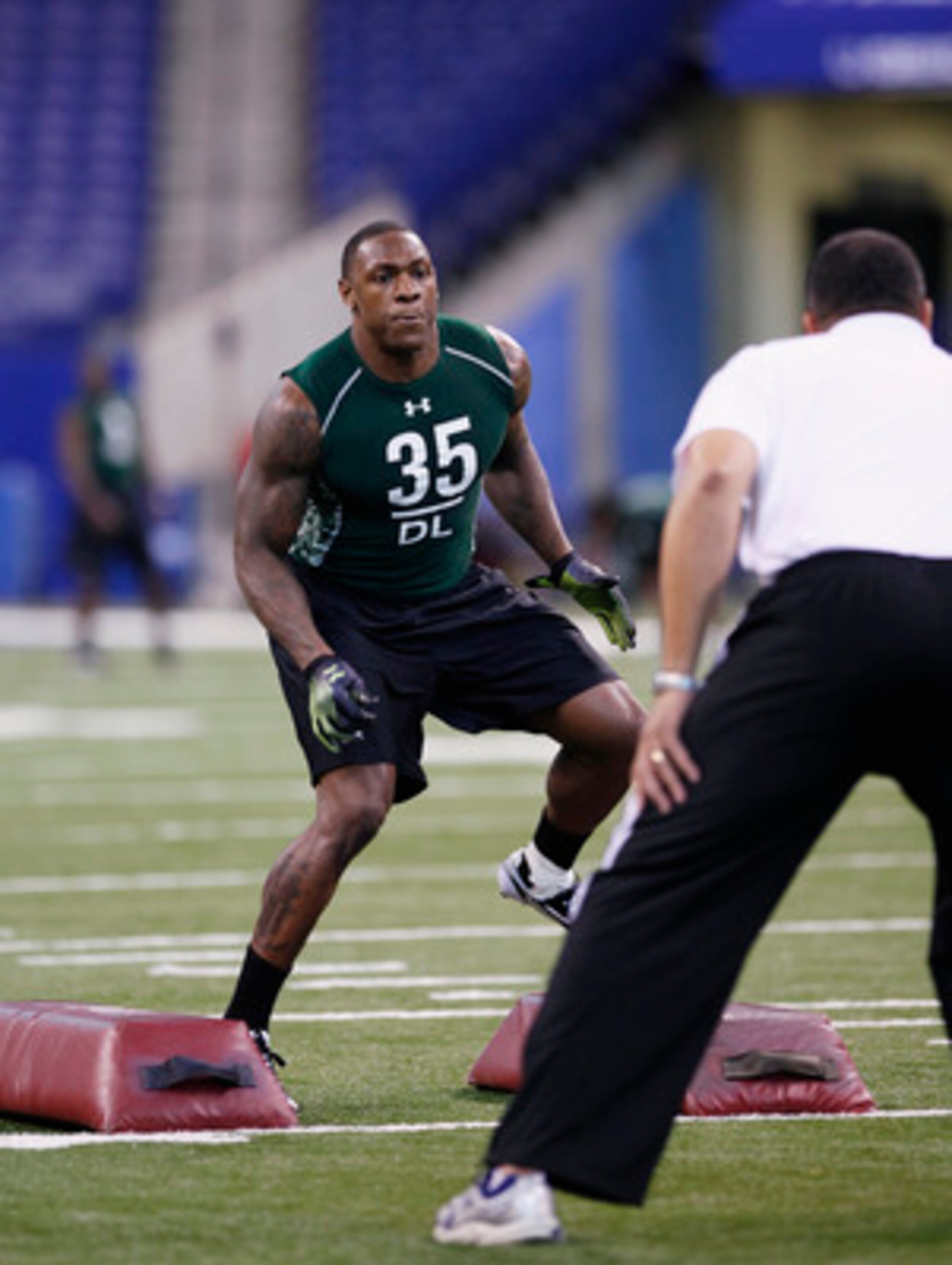 INDIANAPOLIS, IN - FEBRUARY 28: Defensive lineman Dontay Moch of Nevada runs a drill during the 2011 NFL Scouting Combine at Lucas Oil Stadium on February 28, 2011 in Indianapolis, Indiana. (Photo by Joe Robbins/Getty Images)