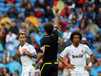 MADRID, SPAIN - APRIL 30:  Ricardo Carvalho of Real Madrid is sent off by referee Miguel Angel Ayza Gamez during the La Liga match between Real Madrid and Real Zaragoza at Estadio Santiago Bernabeu on April 30, 2011 in Madrid, Spain.  (Photo by Julian Fin