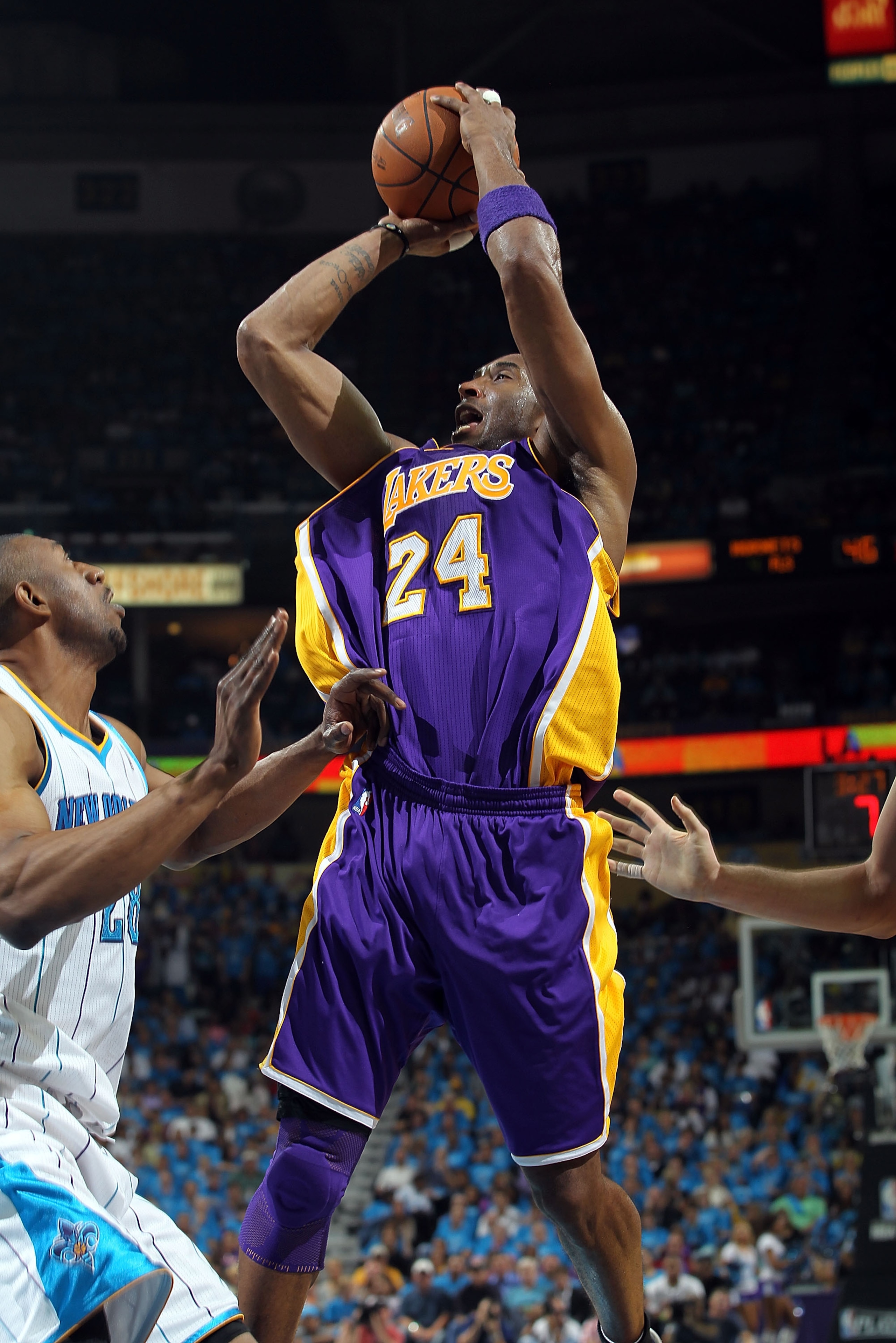 NEW ORLEANS, LA - APRIL 28:  Guard Kobe Bryant #24 of the Los Angeles Lakers takes a shot against D.J. Mbenga #28 of the New Orleans Hornets in Game Six of the Western Conference Quarterfinals in the 2011 NBA Playoffs on April 28, 2011 at New Orleans Aren