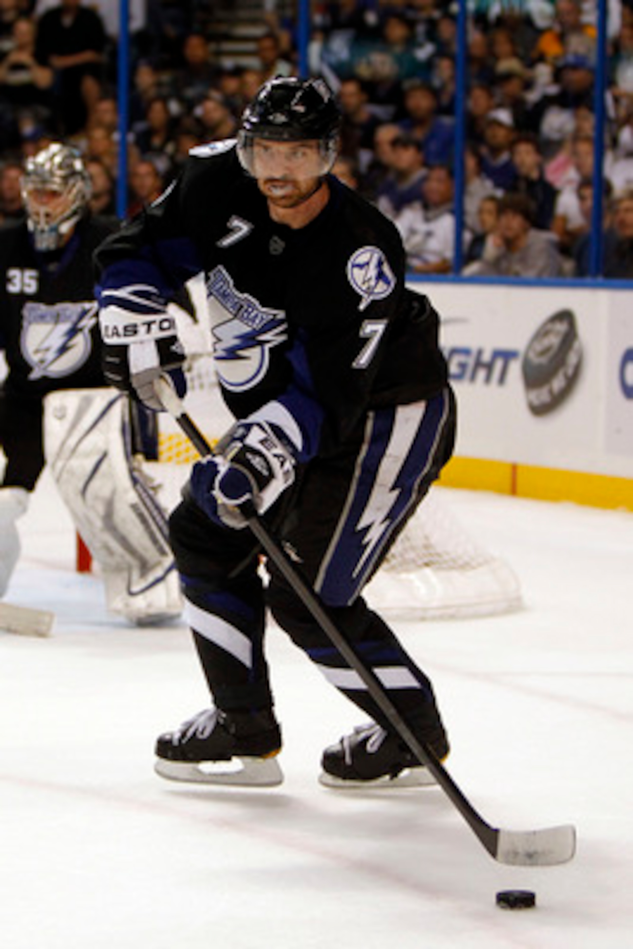 TAMPA, FL - APRIL 20: Brett Clark #7 of the Tampa Bay Lightning skates with the puck against the Pittsburgh Penguins in Game Four of the Eastern Conference Quarterfinals during the 2011 NHL Stanley Cup Playoffs at the St. Pete Times Forum on April 20, 201