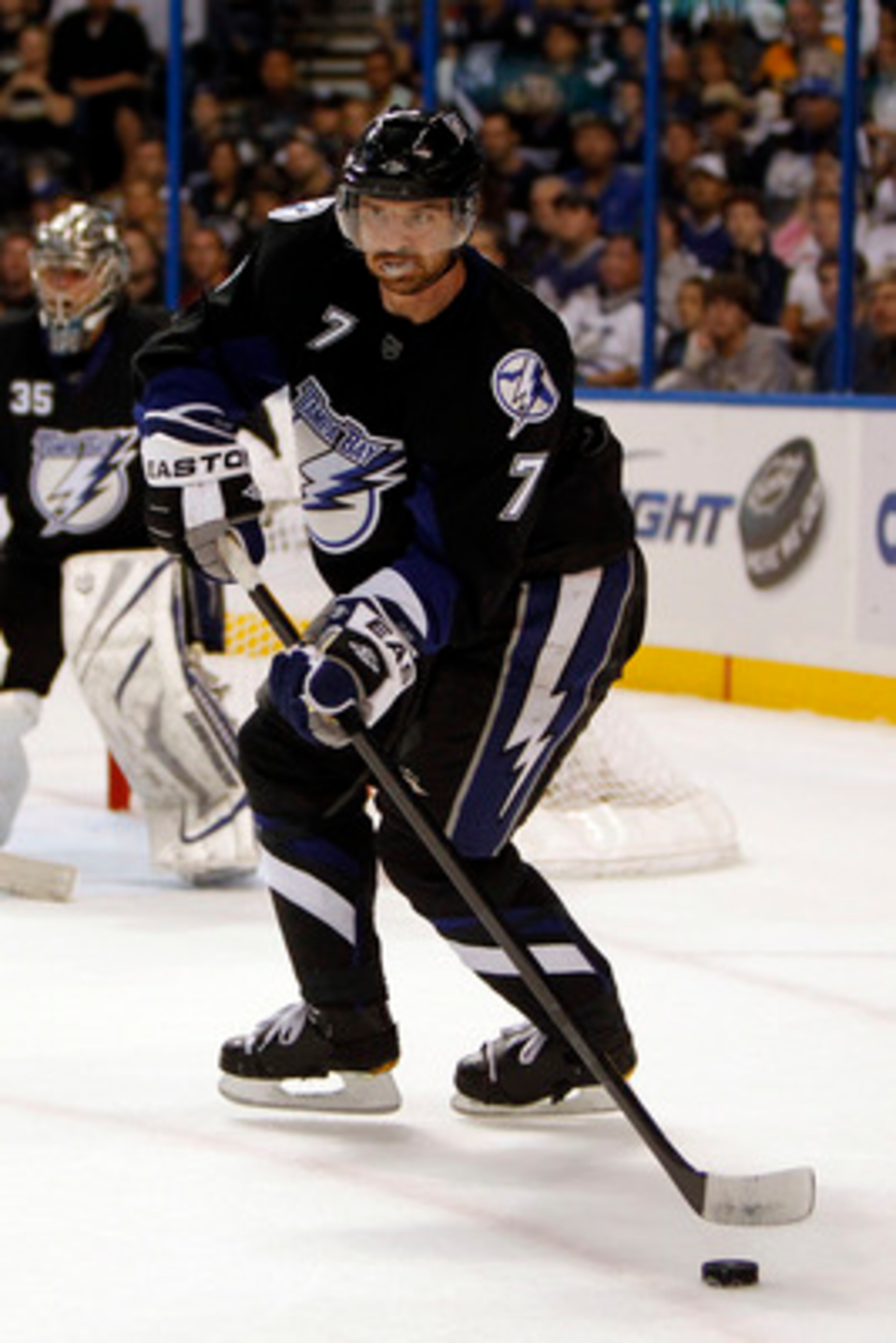 TAMPA, FL - APRIL 20: Brett Clark #7 of the Tampa Bay Lightning skates with the puck against the Pittsburgh Penguins in Game Four of the Eastern Conference Quarterfinals during the 2011 NHL Stanley Cup Playoffs at the St. Pete Times Forum on April 20, 201