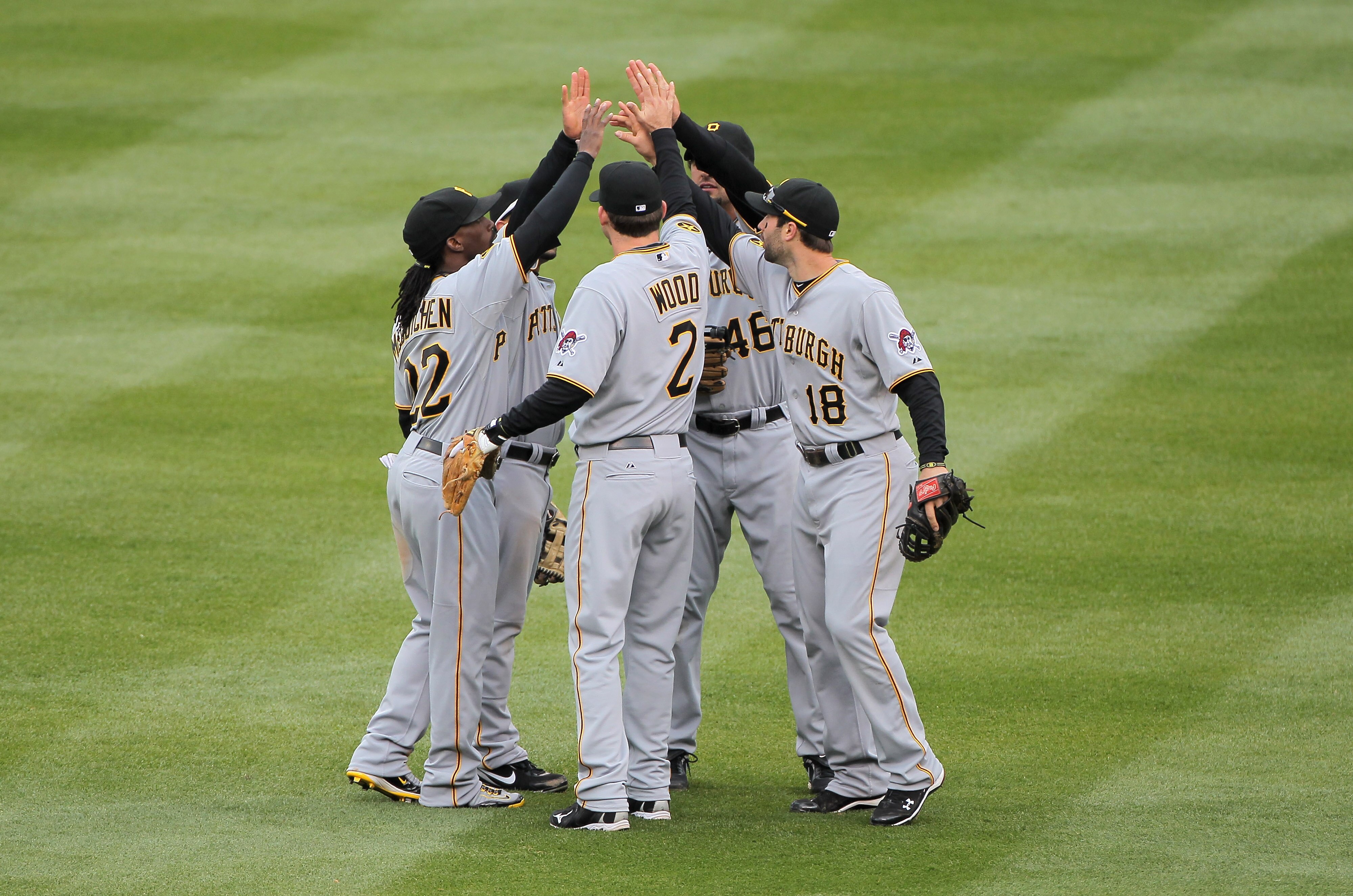 DENVER, CO - MAY 01:  Xavier Paul #38, Andrew McCutchen #22, Brandon Wood #2, Garrett Jones #46, and Neil Walker #18 of the Pittsburgh Pirates celebrate their victory over the Colorado Rockies at Coors Field on May 1, 2011 in Denver, Colorado. The Pirates