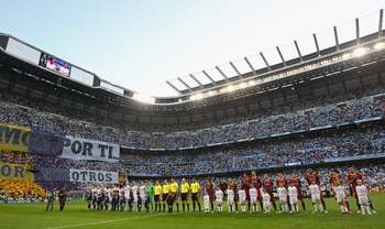 MADRID, SPAIN - APRIL 27:  Players from Real Madrid and Barcelona line up prior to the UEFA Champions League Semi Final first leg match between Real Madrid and Barcelona at Estadio Santiago Bernabeu on April 27, 2011 in Madrid, Spain.  (Photo by Alex Live