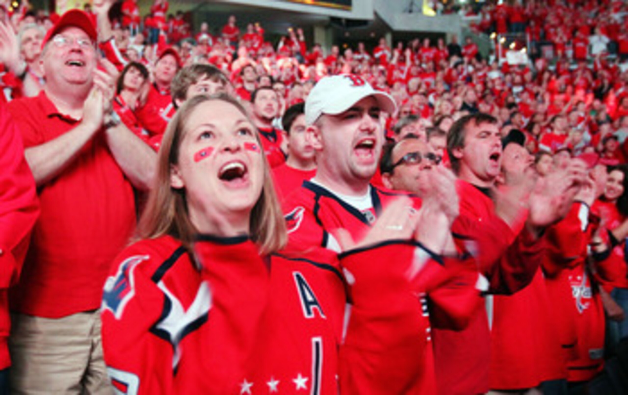 WASHINGTON , DC - APRIL 23: Fans of the Washington Capitals cheer their team on following a 3-1 win over the New York Rangers in Game Five of the Eastern Conference Quarterfinals during the 2011 NHL Stanley Cup Playoffs at the Verizon Center on April 23, WASHINGTON , DC - APRIL 23: Fans of the Washington Capitals cheer their team on following a 3-1 win over the New York Rangers in Game Five of the Eastern Conference Quarterfinals during the 2011 NHL Stanley Cup Playoffs at the Verizon Center on April 23,