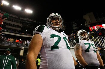 FOXBORO, MA - DECEMBER 06:  (L-R) Mike DeVito #70 and Robert Turner #75 of the New York Jets wait to take the field against the New England Patriots at Gillette Stadium on December 6, 2010 in Foxboro, Massachusetts.  (Photo by Jim Rogash/Getty Images)