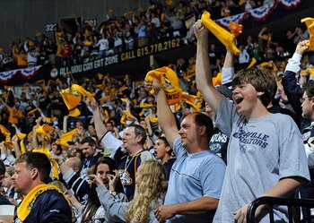 NASHVILLE, TN - APRIL 24:  Fans of the Nashville Predators cheer during a timeout in a game against the Anaheim Ducks in Game Six of the Western Conference Quarterfinals during the 2011 NHL Stanley Cup Playoffs at Bridgestone Arena on April 24, 2011 in Na