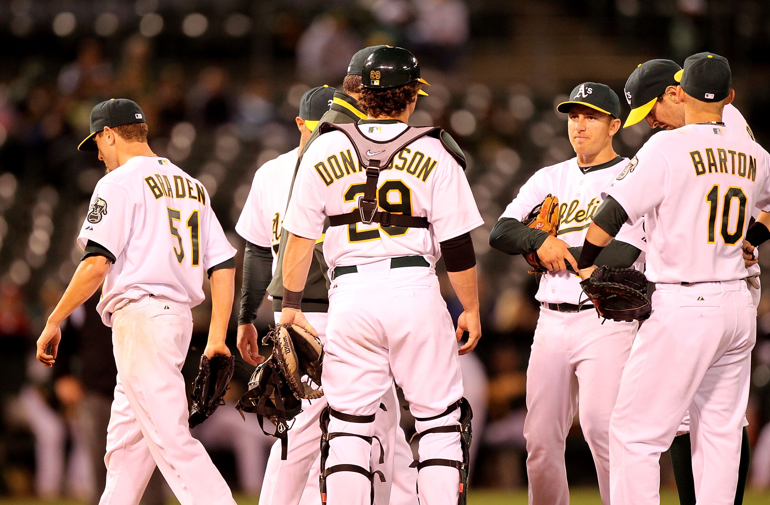 OAKLAND, CA - MAY 03: Dallas Braden #51 of the Oakland Athletics is taken out of the game in the 8th inning against the Texas Rangers during an MLB game at the Oakland-Alameda County Coliseum on May 3, 2010 in Oakland, California.  (Photo by Jed Jacobsohn
