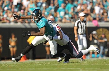 JACKSONVILLE, FL - NOVEMBER 14:  Marcedes Lewis #89 of the Jacksonville Jaguars misses a catch before being tackled by Zac Diles #54 during a game against the Houston Texans at EverBank Field on November 14, 2010 in Jacksonville, Florida.  (Photo by Mike