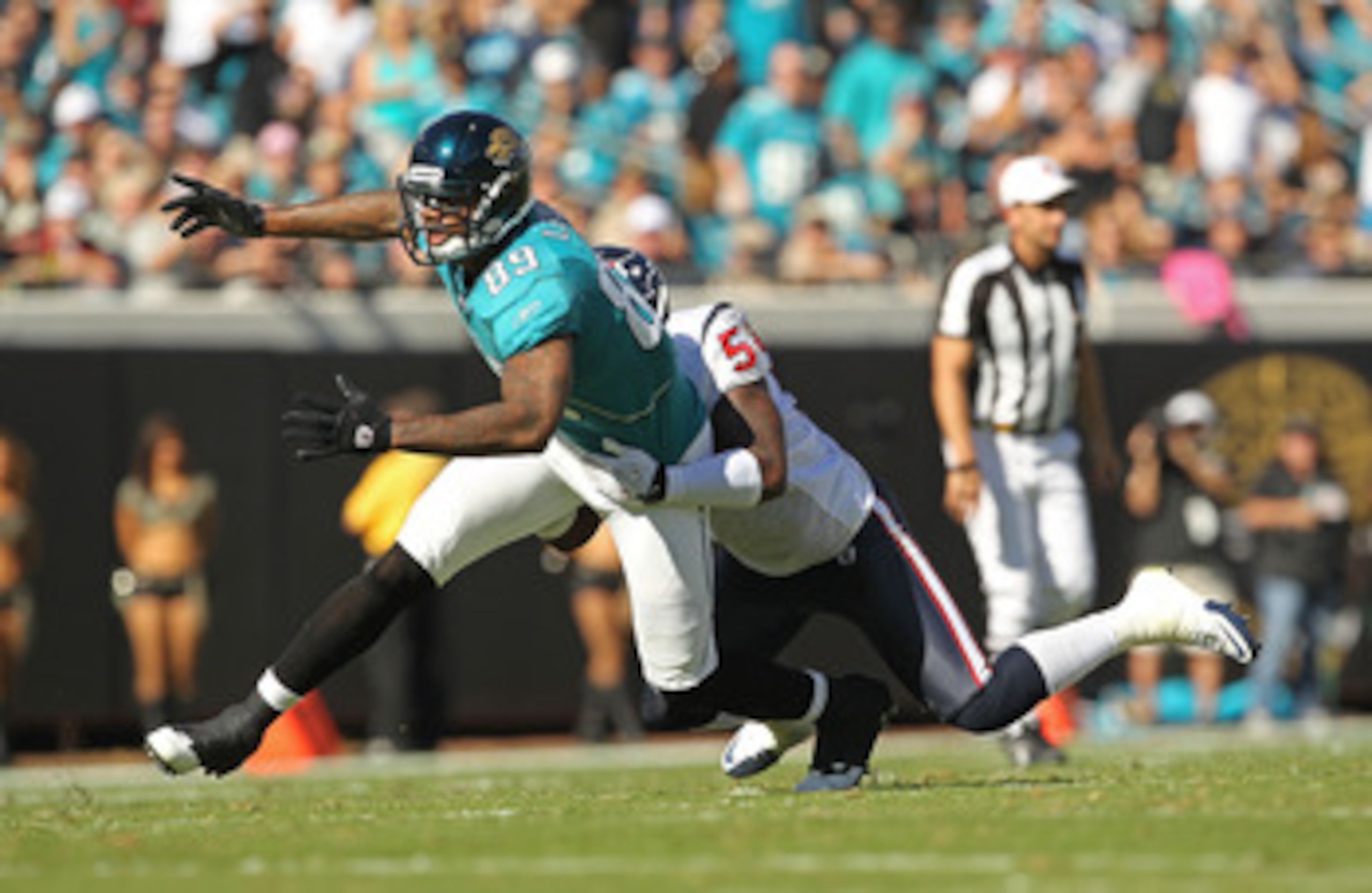JACKSONVILLE, FL - NOVEMBER 14:  Marcedes Lewis #89 of the Jacksonville Jaguars misses a catch before being tackled by Zac Diles #54 during a game against the Houston Texans at EverBank Field on November 14, 2010 in Jacksonville, Florida.  (Photo by Mike