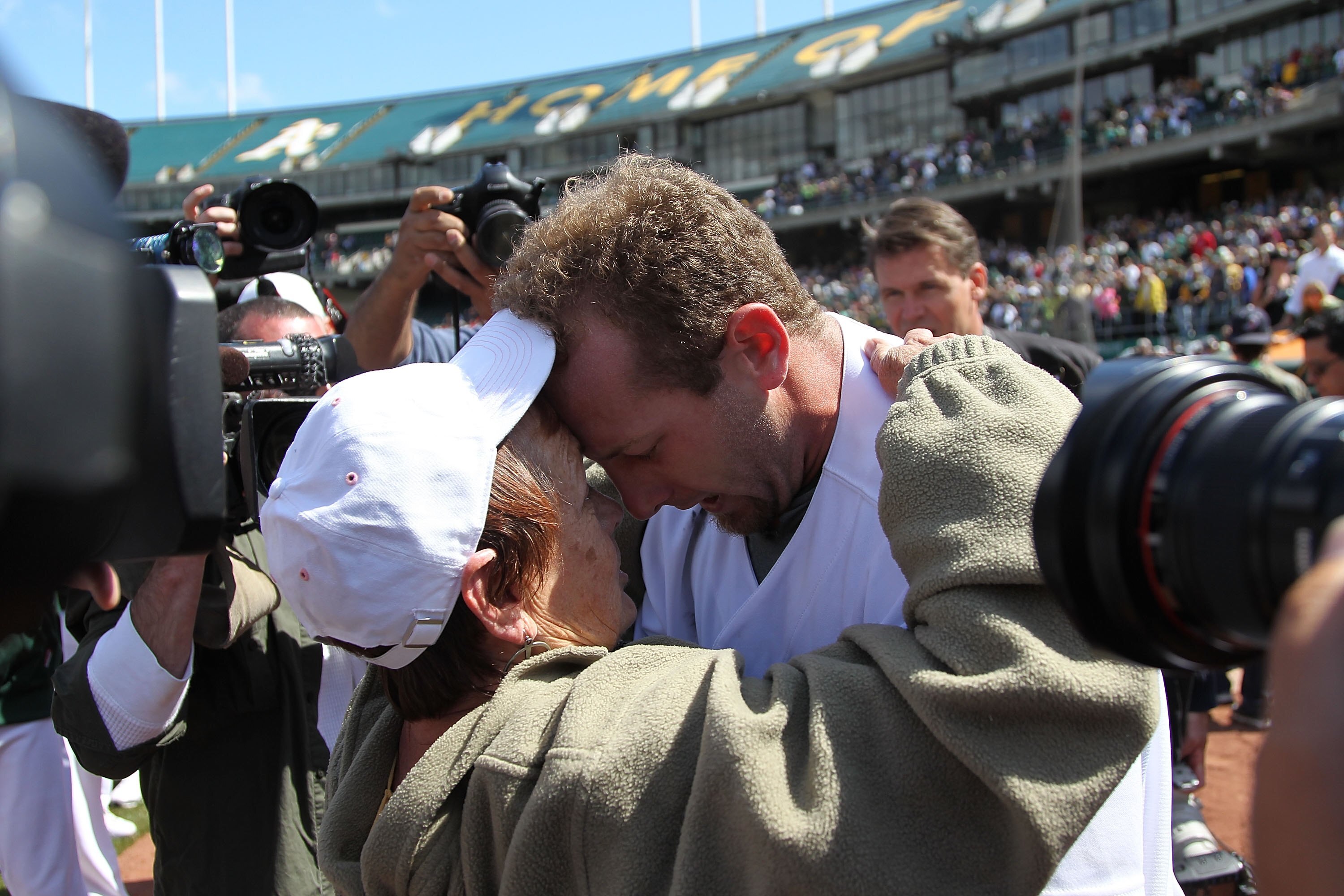 OAKLAND, CA - MAY 09:  Dallas Braden #51 of the Oakland Athletics celebrates after pitching a perfect game against the Tampa Bay Rays with his grandmother Peggy Lindsey during an MLB game at the Oakland-Alameda County Coliseum on May 9, 2010 in Oakland, C