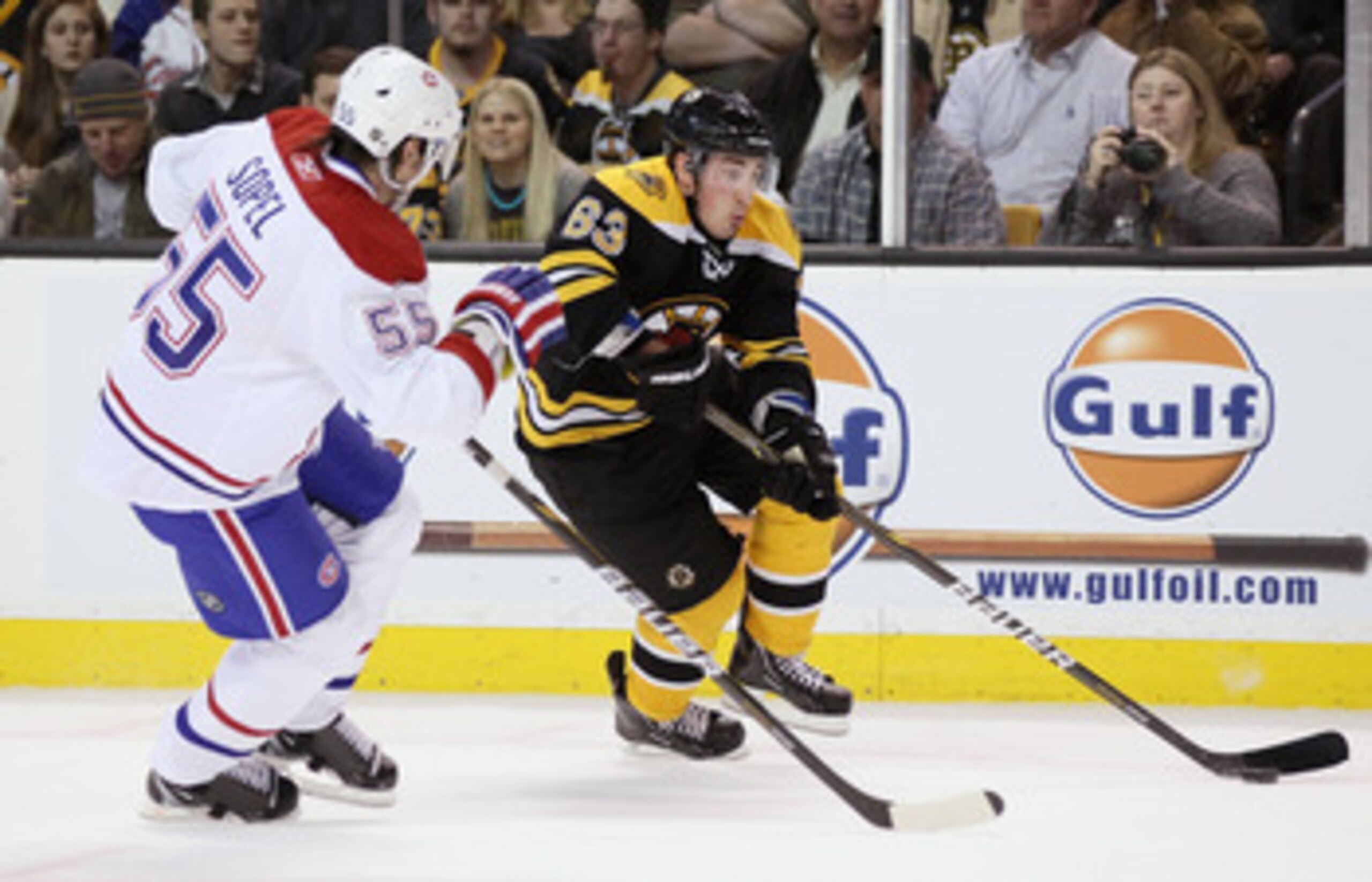 BOSTON, MA - MARCH 24:  Brad Marchand #63 of the Boston Bruins heads for the net as Brent Sopel #55 of the Montreal Canadiens defends on March 24, 2011 at the TD Garden in Boston, Massachusetts.  The Boston Bruins defeated the Montreal Canadiens 7-0.  (Ph