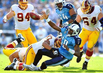 NASHVILLE, TN - NOVEMBER 21:  Lorenzo Alexander #97 of the Washington Redskins forces a fumble by quarterback Vince Young #10 of the Tennessee Titans during the first half at LP Field on November 21, 2010 in Nashville, Tennessee.  (Photo by Grant Halverso