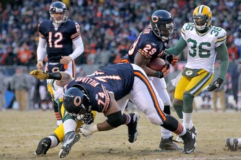 CHICAGO, IL - JANUARY 23:  Running back Chester Taylor #29 of the Chicago Bears scores a one-yard fourth quarter touchdown against the Green Bay Packers in the NFC Championship Game at Soldier Field on January 23, 2011 in Chicago, Illinois.  (Photo by Dou