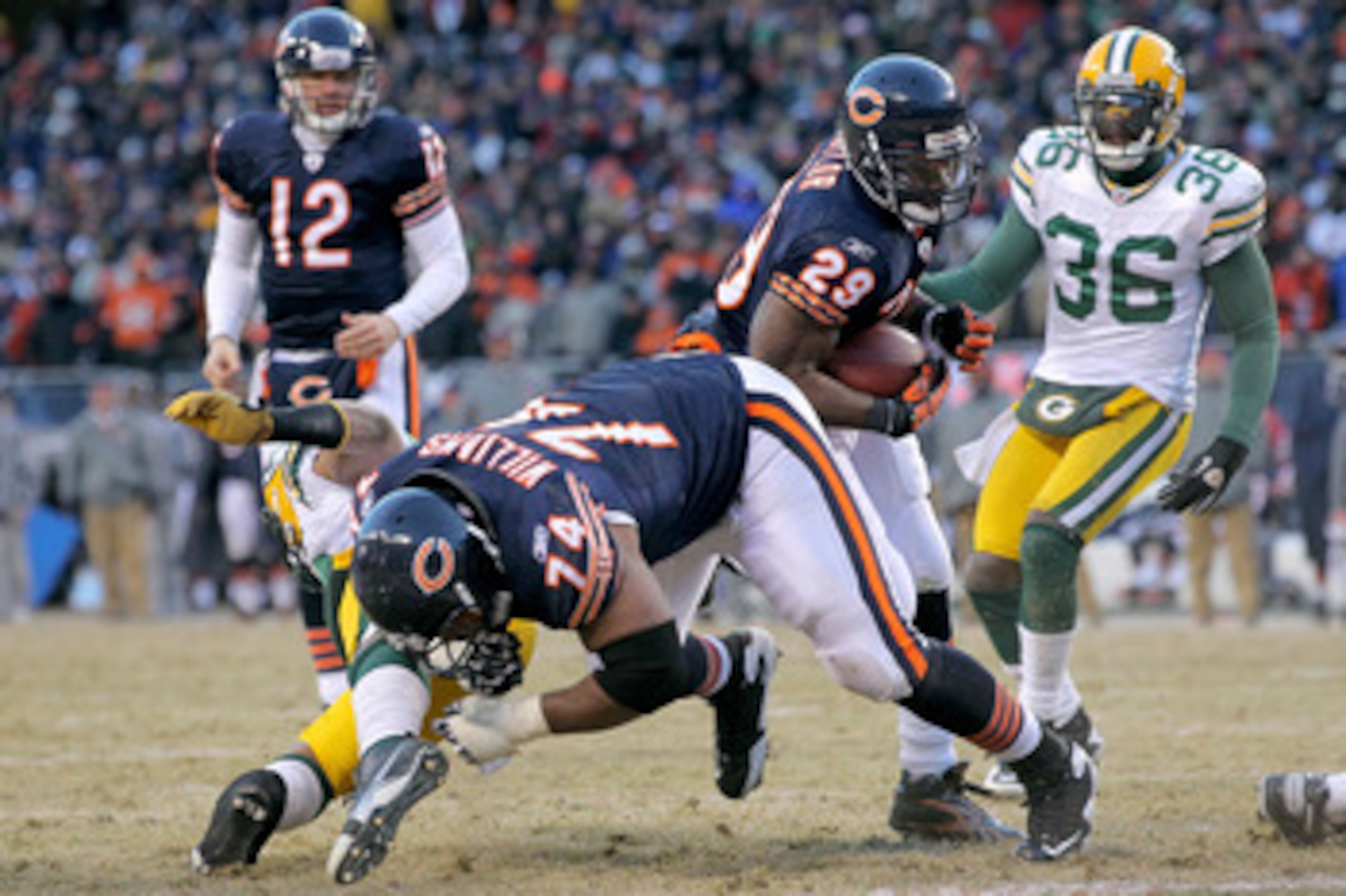 CHICAGO, IL - JANUARY 23:  Running back Chester Taylor #29 of the Chicago Bears scores a one-yard fourth quarter touchdown against the Green Bay Packers in the NFC Championship Game at Soldier Field on January 23, 2011 in Chicago, Illinois.  (Photo by Dou