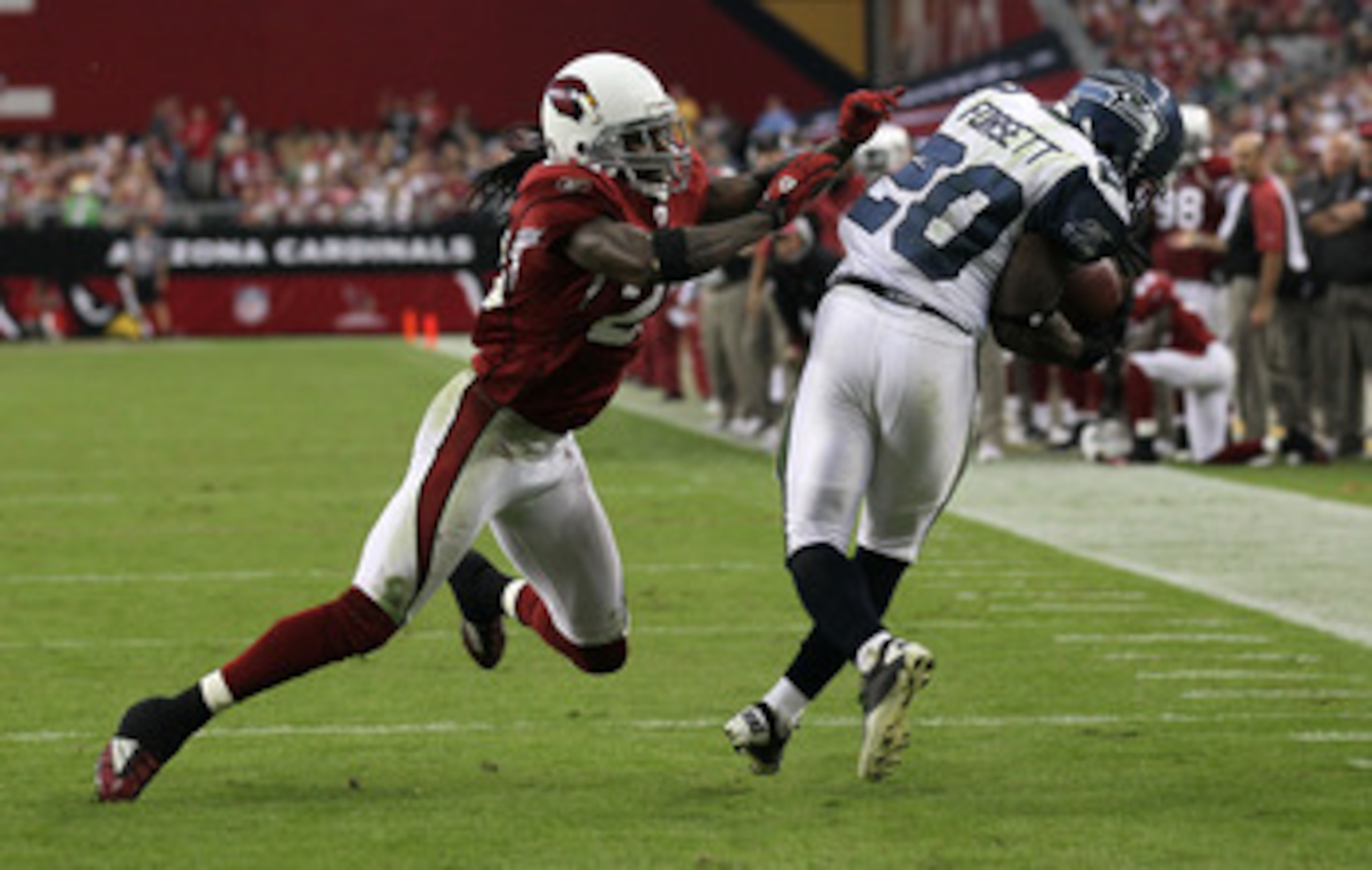 GLENDALE, AZ - NOVEMBER 14:   Cornerback Greg Toler #28 of the Arizona Cardinals knocks down running back Justin Forsett #20 of the Seattle Seahawks after a pass reception at University of Phoenix Stadium on November 14, 2010 in Glendale, Arizona. Seattle