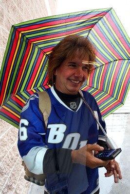 TAMPA, FL - APRIL 25: A Tampa Bay Lightning fan arrives in a rain storm prior to the start of the game against the Pittsburgh Penguins in Game Six of the Eastern Conference Quarterfinals during the 2011 NHL Stanley Cup Playoffs at the St. Pete Times Forum