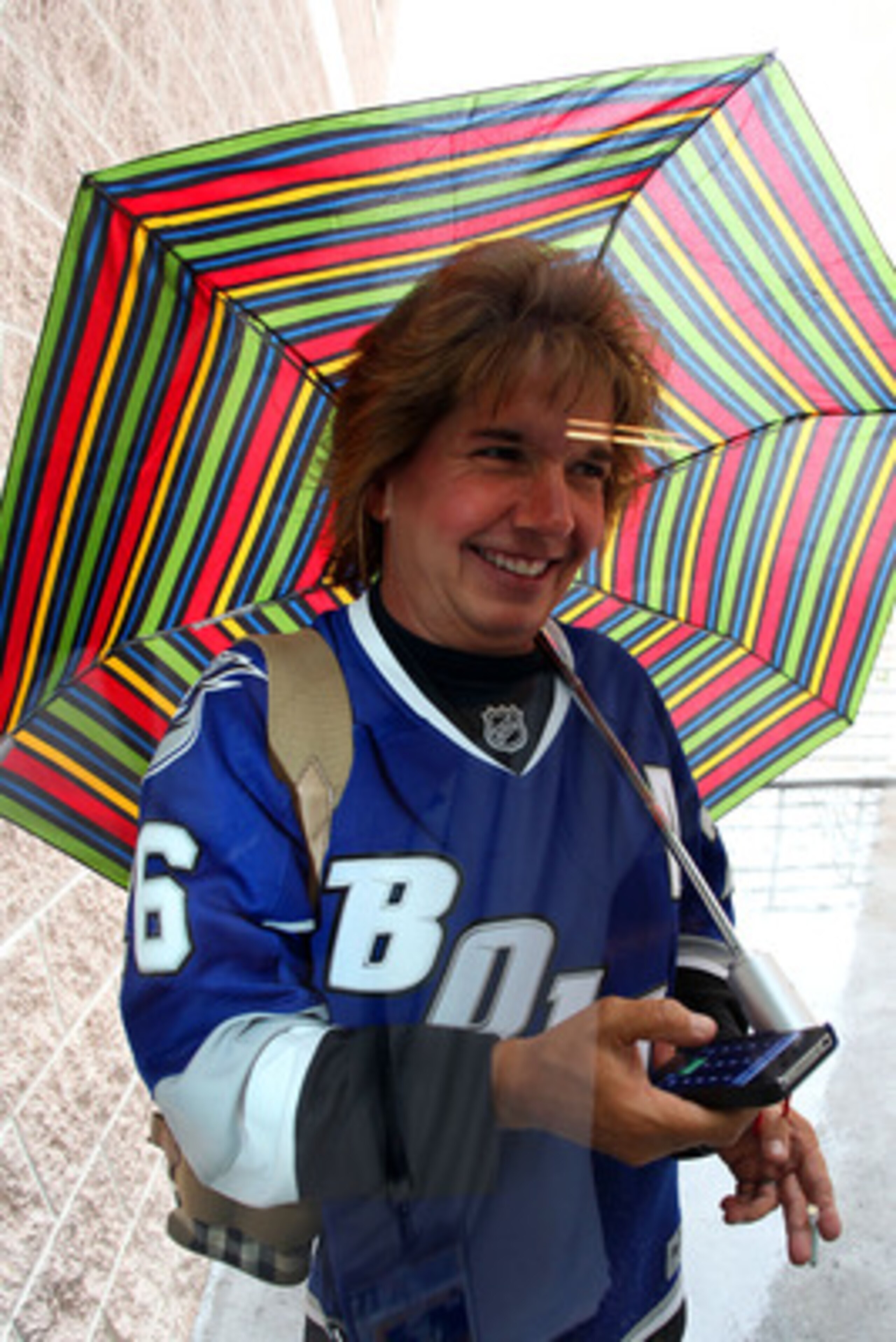 TAMPA, FL - APRIL 25: A Tampa Bay Lightning fan arrives in a rain storm prior to the start of the game against the Pittsburgh Penguins in Game Six of the Eastern Conference Quarterfinals during the 2011 NHL Stanley Cup Playoffs at the St. Pete Times Forum TAMPA, FL - APRIL 25: A Tampa Bay Lightning fan arrives in a rain storm prior to the start of the game against the Pittsburgh Penguins in Game Six of the Eastern Conference Quarterfinals during the 2011 NHL Stanley Cup Playoffs at the St. Pete Times Forum