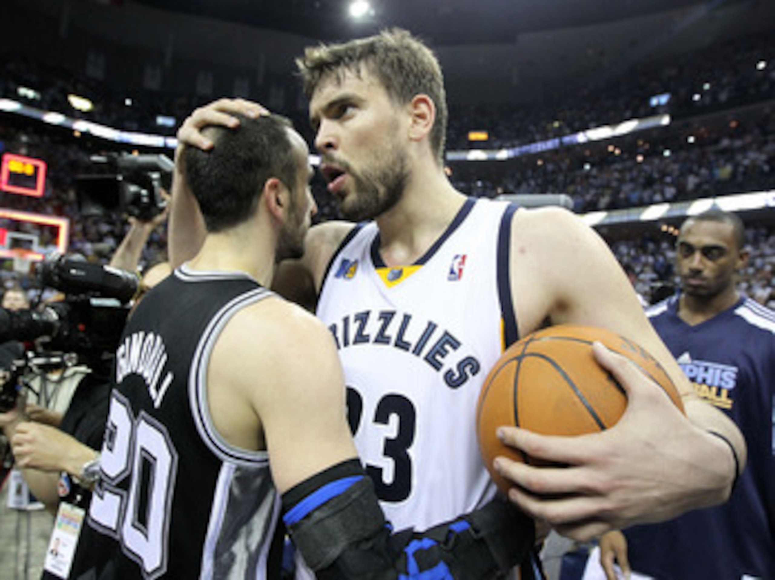 MEMPHIS, TN - APRIL 29:  Marc Gasol #33 of the Memphis Grizzlies hugs Manu Ginobili #20 of the San Antonio Spurs after the Grizzlies beat the San Antonio Spurs 99-91 in Game Six of the Western Conference Quarterfinals in the 2011 NBA Playoffs at FedExForu
