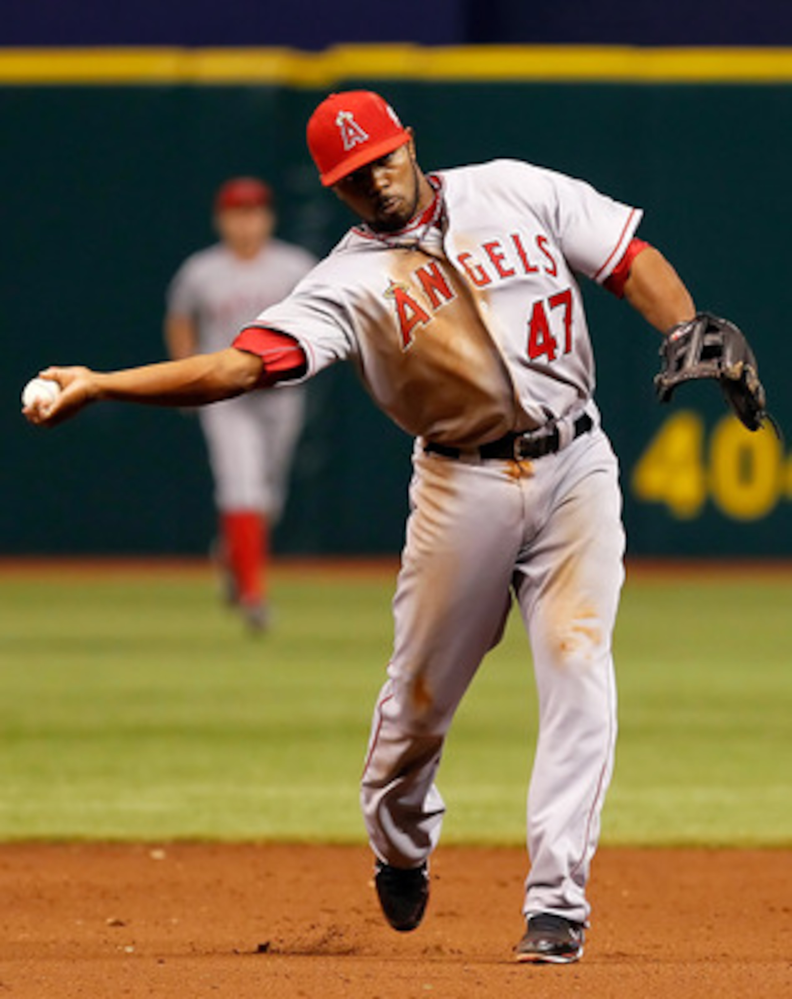 ST. PETERSBURG, FL - APRIL 29:  Infielder Howie Kendrick #47 of the Los Angeles Angels of Anaheim throws over to first for an out against the Tampa Bay Rays during the game at Tropicana Field on April 29, 2011 in St. Petersburg, Florida.  (Photo by J. Mer