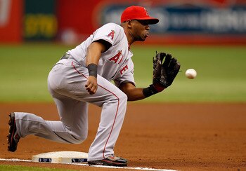 ST. PETERSBURG, FL - MAY 01:  Infielder Alberto Callaspo #6 of the Los Angeles Angels of Anaheim takes the throw at third against the Tampa Bay Rays during the game at Tropicana Field on May 1, 2011 in St. Petersburg, Florida.  (Photo by J. Meric/Getty Im