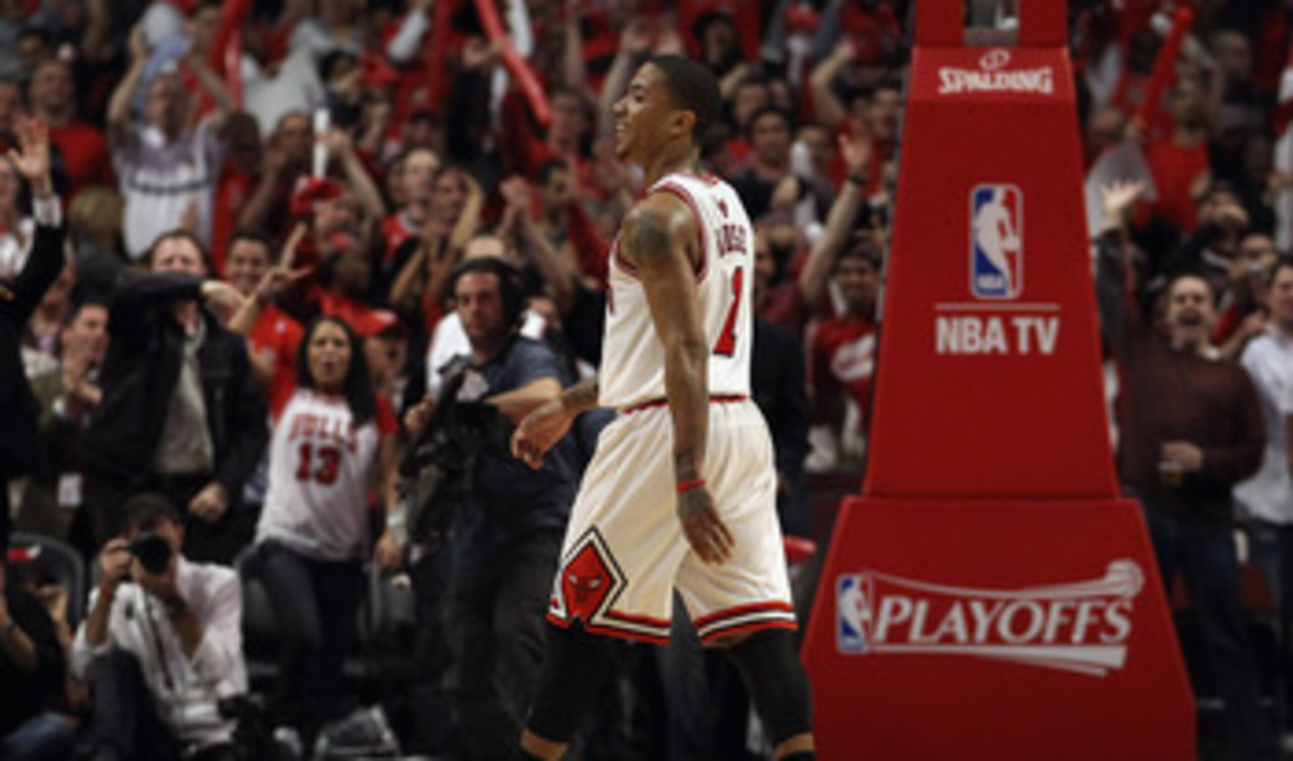 CHICAGO, IL - APRIL 26: Derrick Rose #1 of the Chicago Bulls smiles as he walks off of the court as fans cheer during a time-out against the Indiana Pacers in Game Five of the Eastern Conference Quarterfinals in the 2011 NBA Playoffs at the United Center