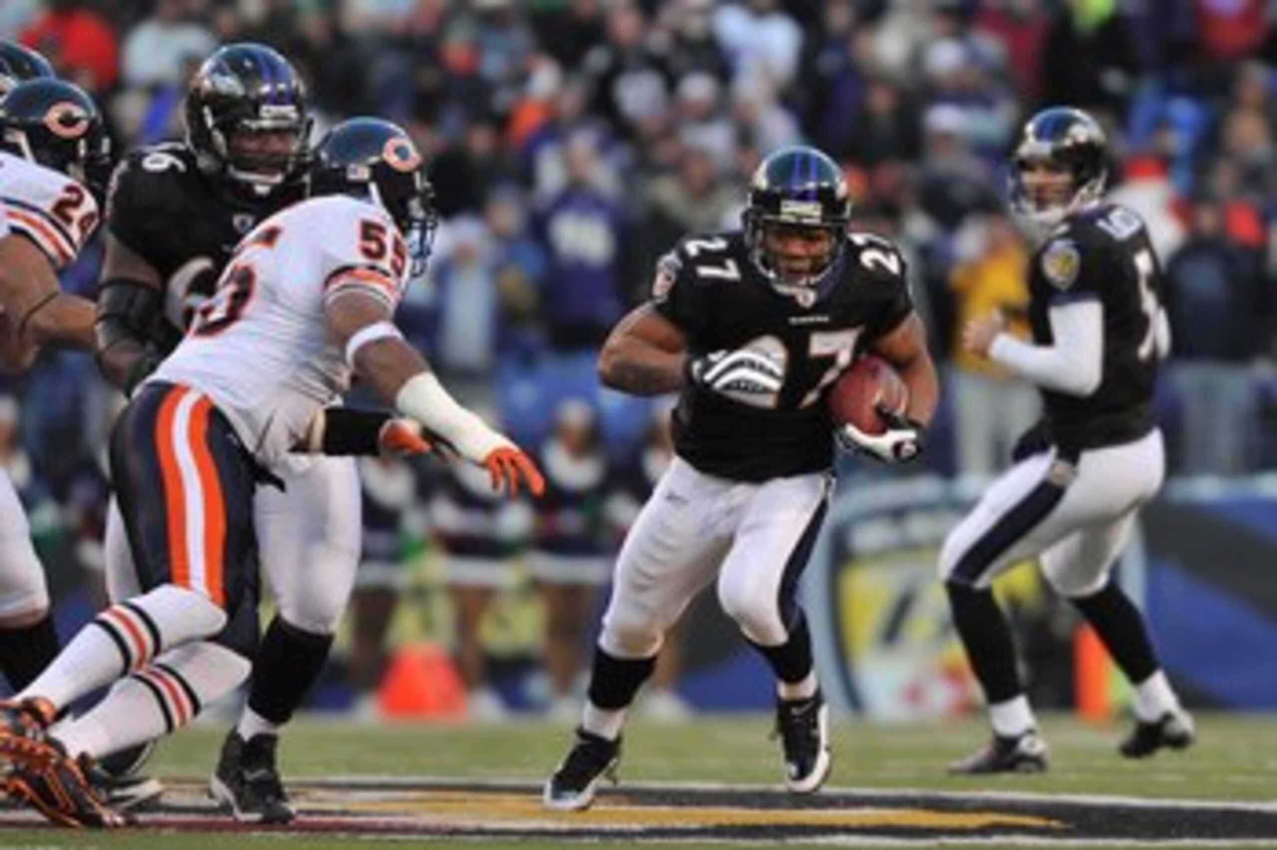 BALTIMORE - DECEMBER 20:  Ray Rice #27 of the Baltimore Ravens runs the ball during the game against the Chicago Bears at M&T Bank Stadium on December 20, 2009 in Baltimore, Maryland. The Ravens defeated the Bears 31-7. (Photo by Larry French/Getty Images