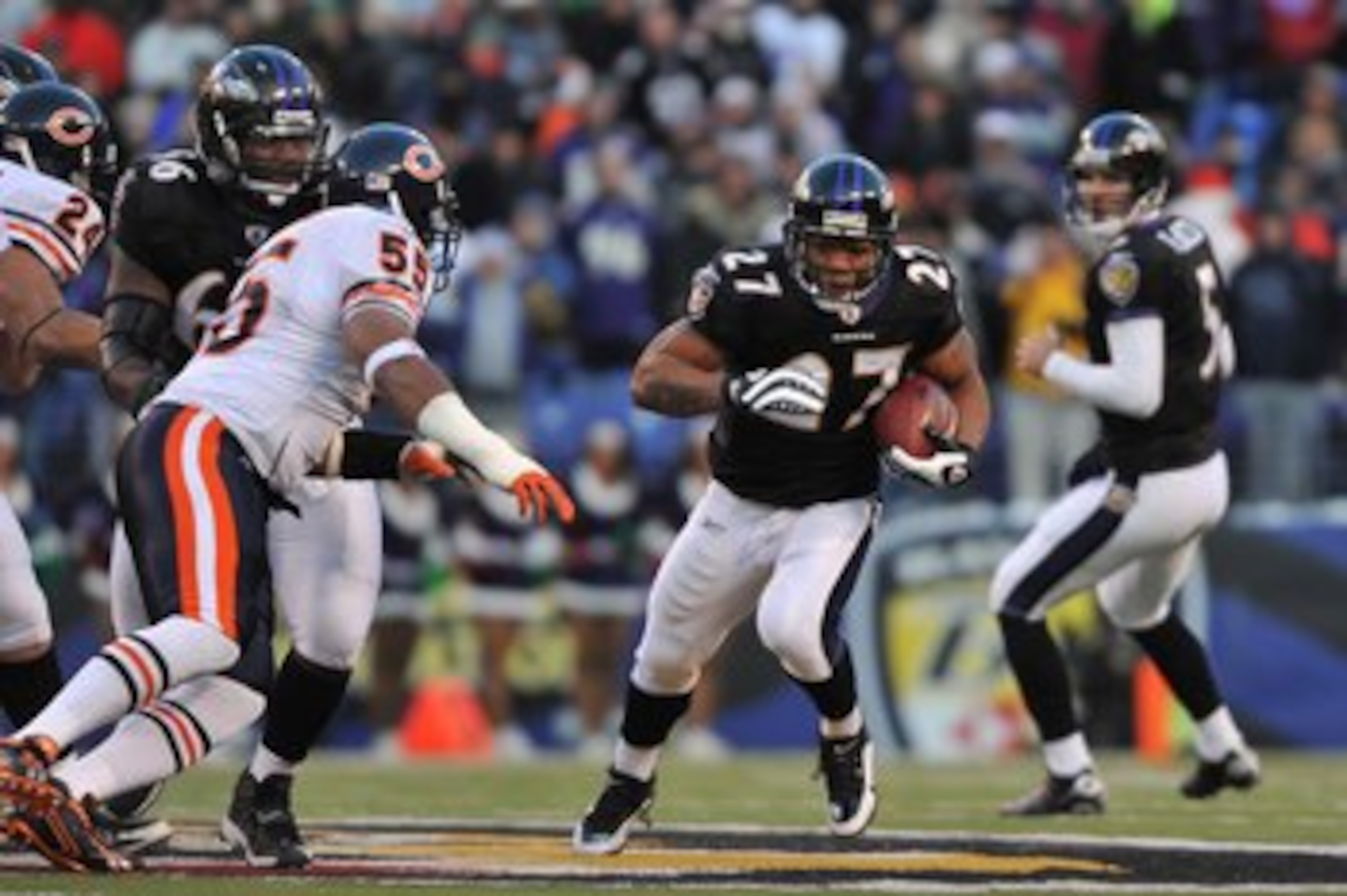 BALTIMORE - DECEMBER 20:  Ray Rice #27 of the Baltimore Ravens runs the ball during the game against the Chicago Bears at M&T Bank Stadium on December 20, 2009 in Baltimore, Maryland. The Ravens defeated the Bears 31-7. (Photo by Larry French/Getty Images