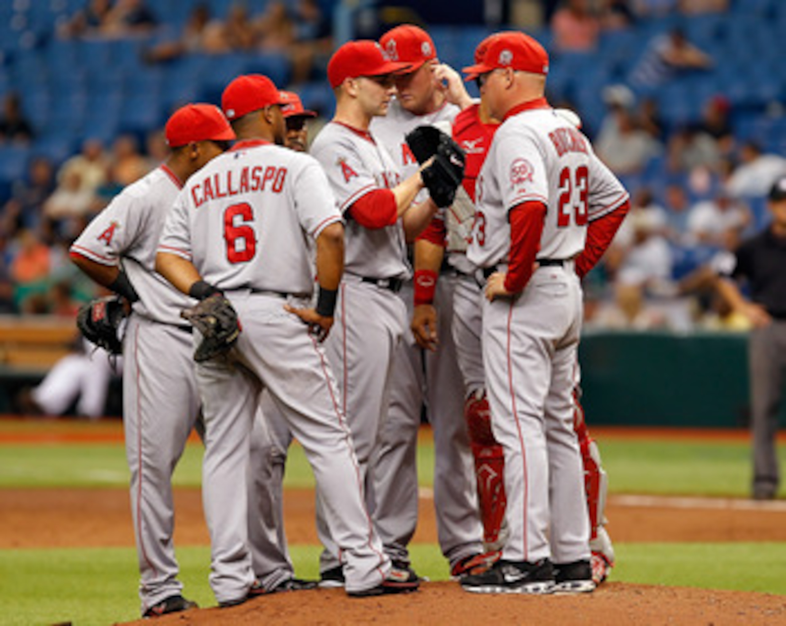 ST. PETERSBURG, FL - MAY 01:  Pitching coach Mike Butcher #23 of the Los Angeles Angels of Anaheim talks with pitcher Tyler Chatwood #52 during the game against the Tampa Bay Rays at Tropicana Field on May 1, 2011 in St. Petersburg, Florida.  (Photo by J.