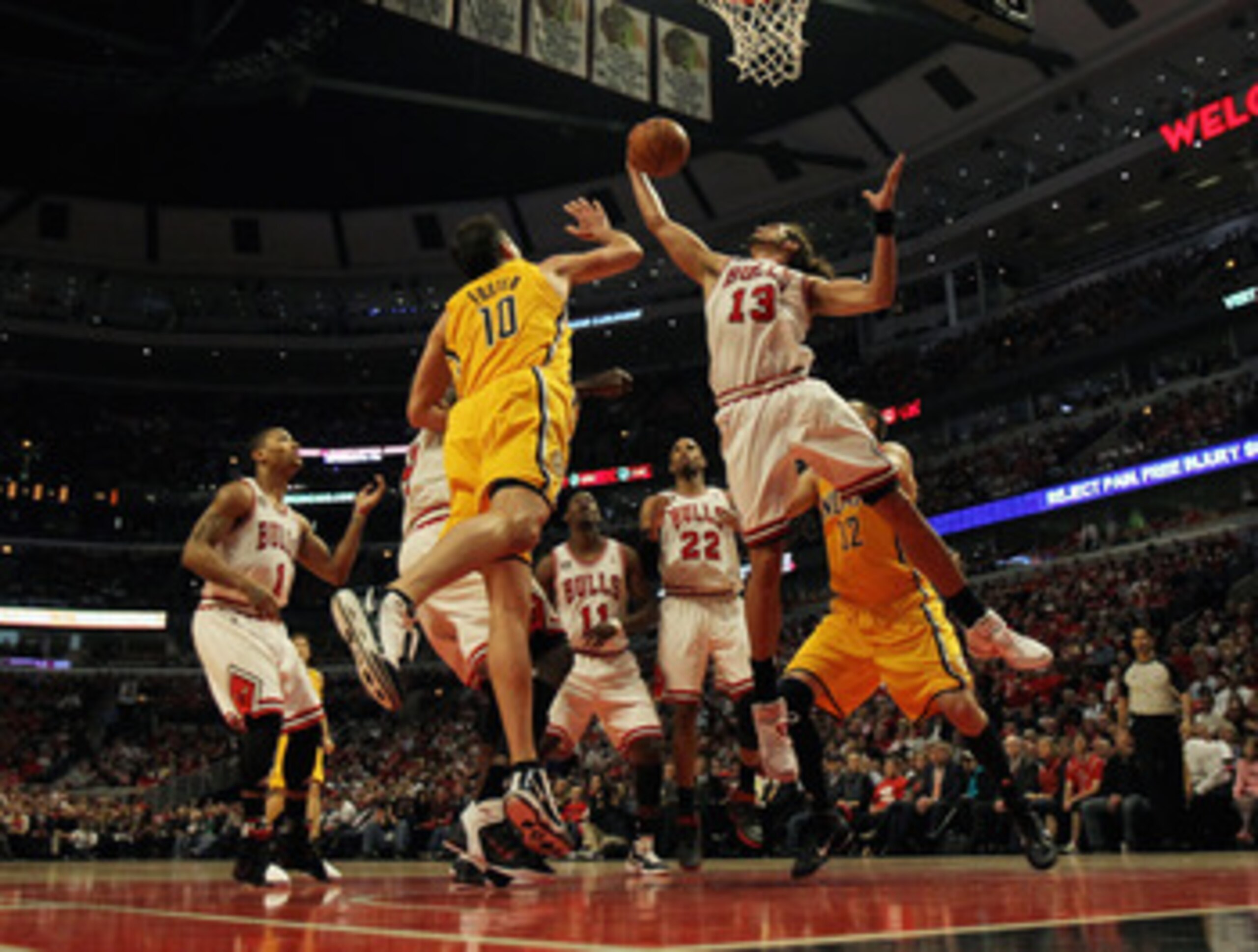 CHICAGO, IL - APRIL 26: Joakim Noah #13 of the Chicago Bulls grabs a rebound away from Jeff Foster #10 of the Indiana Pacers in Game Five of the Eastern Conference Quarterfinals in the 2011 NBA Playoffs at the United Center on April 26, 2011 in Chicago, I