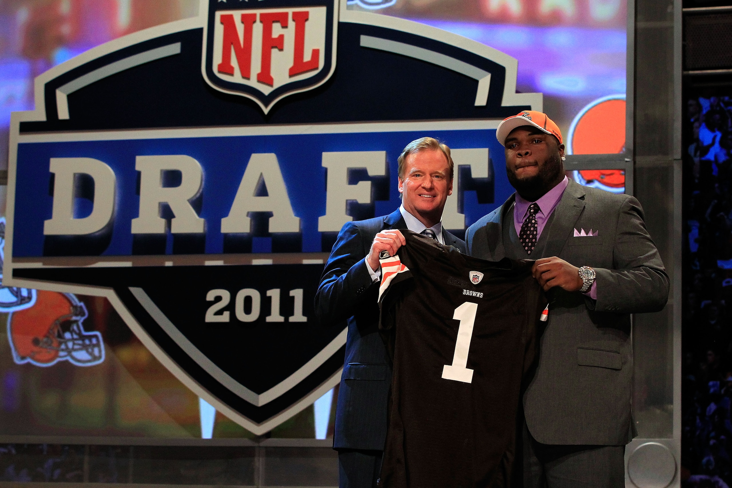 NEW YORK, NY - APRIL 28: NFL Commissioner Roger Goodell (L) poses for a photo with Phil Taylor, #21 overall pick by the Cleveland Browns, on stage during the 2011 NFL Draft at Radio City Music Hall on April 28, 2011 in New York City. (Photo by Chris Tro NEW YORK, NY - APRIL 28: NFL Commissioner Roger Goodell (L) poses for a photo with Phil Taylor, #21 overall pick by the Cleveland Browns, on stage during the 2011 NFL Draft at Radio City Music Hall on April 28, 2011 in New York City. (Photo by Chris Tro