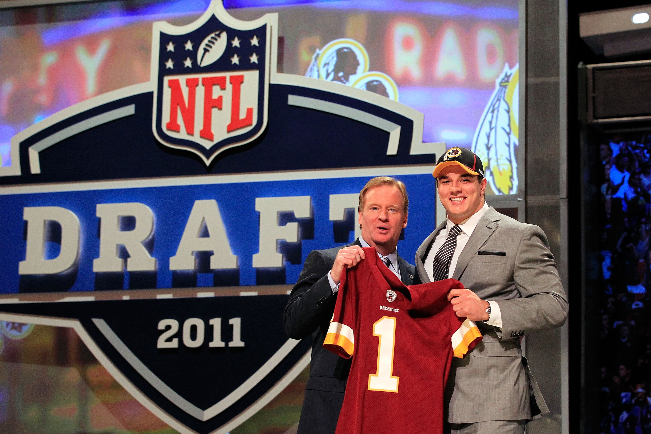 NEW YORK, NY - APRIL 28: NFL Commissioner Roger Goodell (L) poses for a photo with Ryan Kerrigan, #16 overall pick by the Washington Redskins, on stage during the 2011 NFL Draft at Radio City Music Hall on April 28, 2011 in New York City. (Photo by Chri NEW YORK, NY - APRIL 28: NFL Commissioner Roger Goodell (L) poses for a photo with Ryan Kerrigan, #16 overall pick by the Washington Redskins, on stage during the 2011 NFL Draft at Radio City Music Hall on April 28, 2011 in New York City. (Photo by Chri