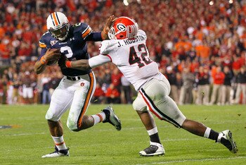 AUBURN, AL - NOVEMBER 13:  Quarterback Cameron Newton #2 of the Auburn Tigers breaks a tackle by Justin Houston #42 of the Georgia Bulldogs at Jordan-Hare Stadium on November 13, 2010 in Auburn, Alabama.  (Photo by Kevin C. Cox/Getty Images)