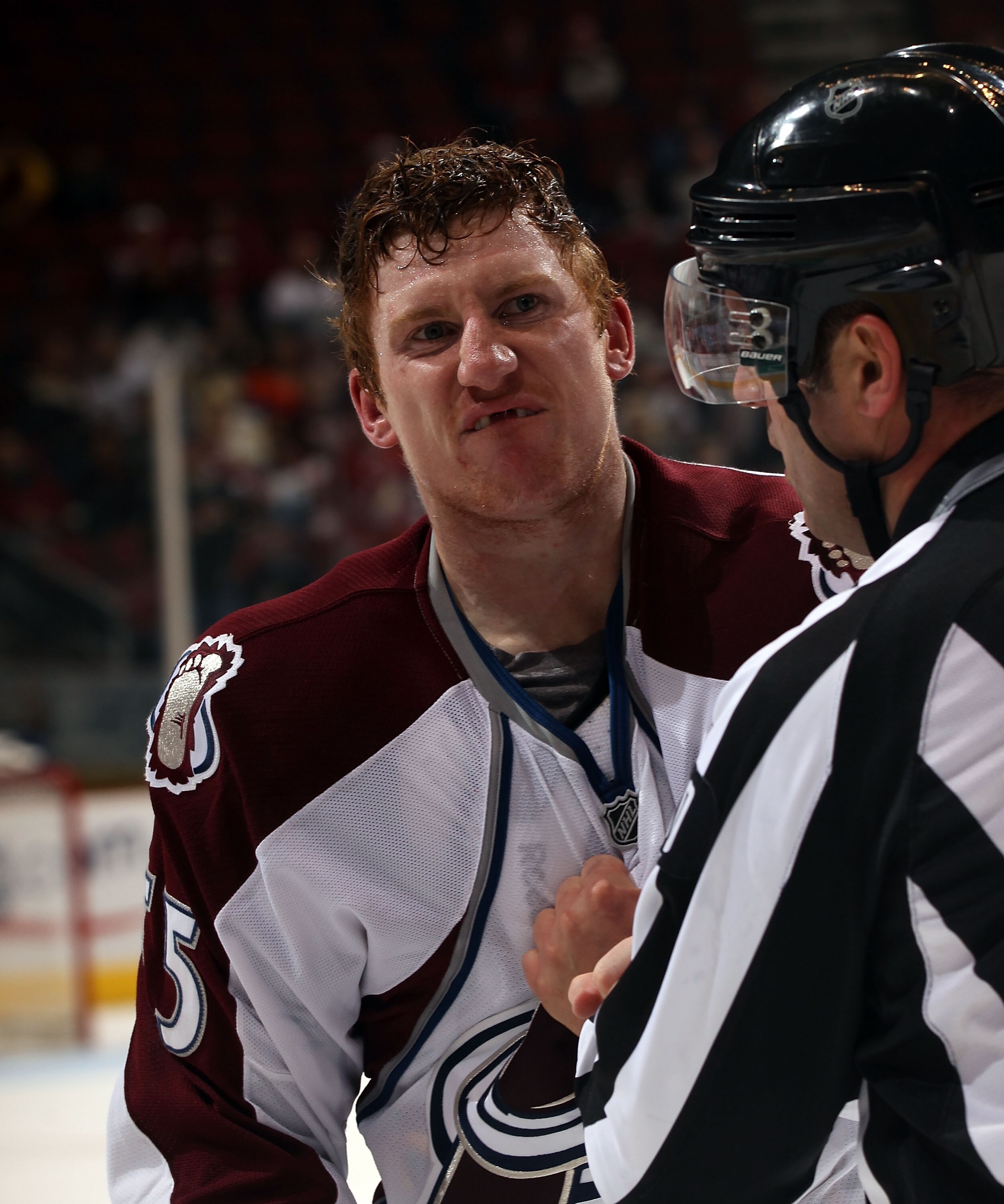 GLENDALE, AZ - FEBRUARY 07:  Linesman Andy McElman #90 escourts Cody McLeod #55 of the Colorado Avalanche off the ice in the third period against the Phoenix Coyotes at the Jobing.com Arena on February 7, 2011 in Glendale, Arizona. The Phoenix Coyotes def