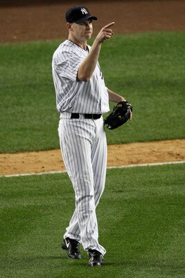 NEW YORK - OCTOBER 20:  Kerry Wood #39 of the New York Yankees gestures towards Alex Rodriguez #13 after Rodriguez threw out Ian Kinsler #5 of the Texas Rangers at first base to end the top of the eighth inning of Game Five of the ALCS during the 2010 MLB