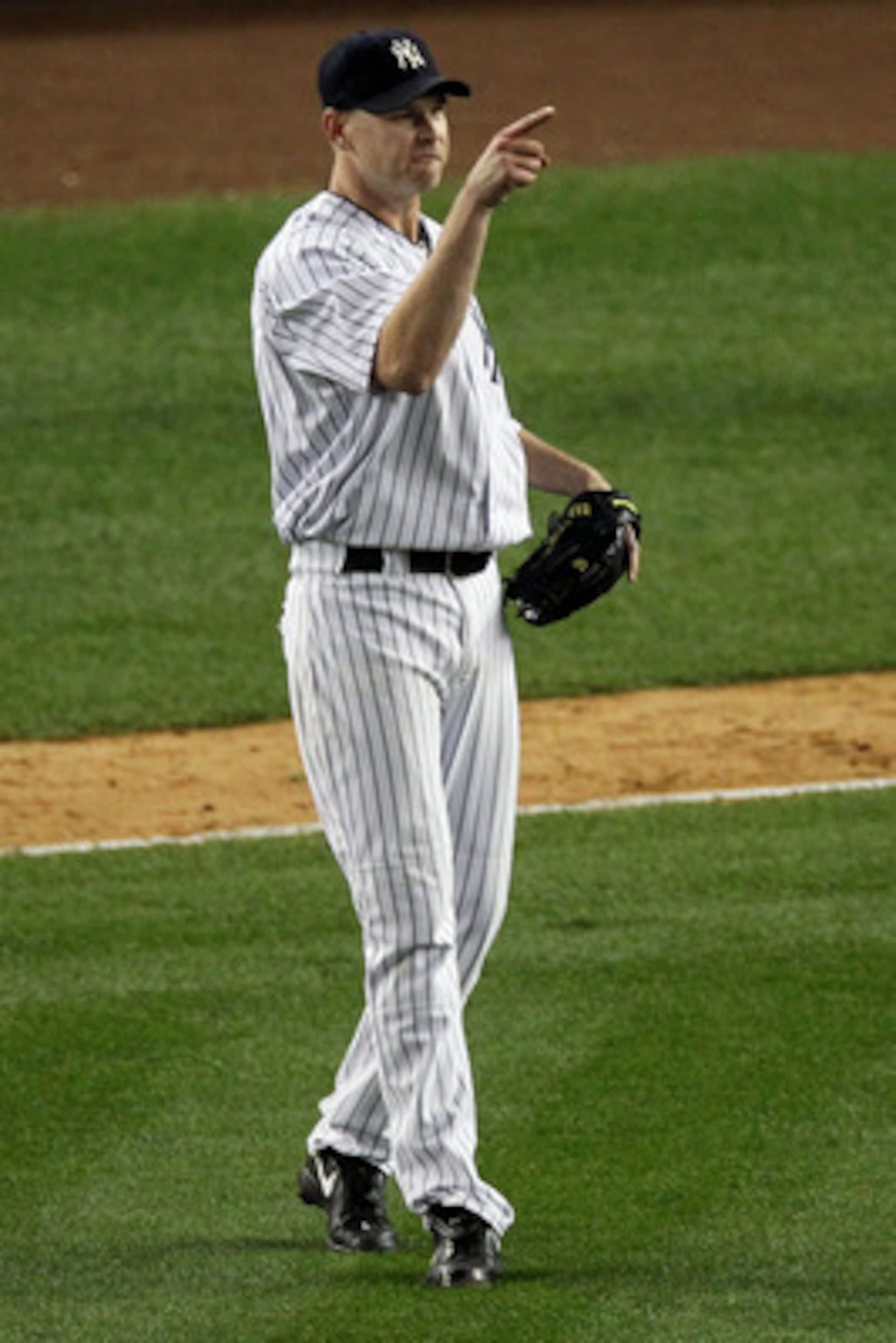NEW YORK - OCTOBER 20:  Kerry Wood #39 of the New York Yankees gestures towards Alex Rodriguez #13 after Rodriguez threw out Ian Kinsler #5 of the Texas Rangers at first base to end the top of the eighth inning of Game Five of the ALCS during the 2010 MLB