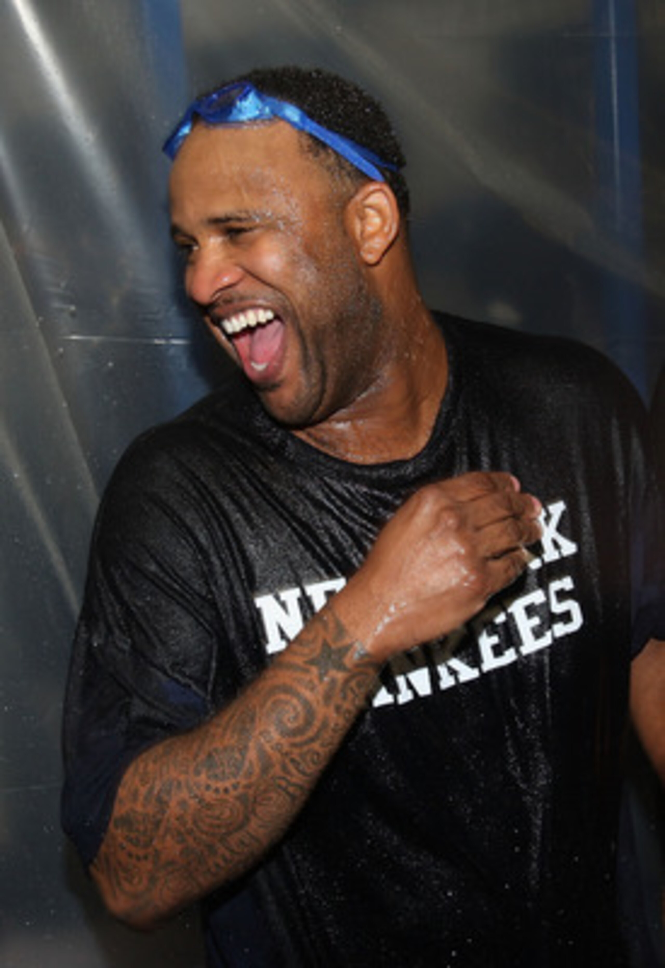 MINNEAPOLIS - OCTOBER 11: C.C. Sabathia of the New York Yankees celebrates in the locker room after a win over the Minnesota Twins in Game Three of the ALDS during the 2009 MLB Playoffs at the Hubert H. Humphrey Metrodome on October 11, 2009 in Minneapoli