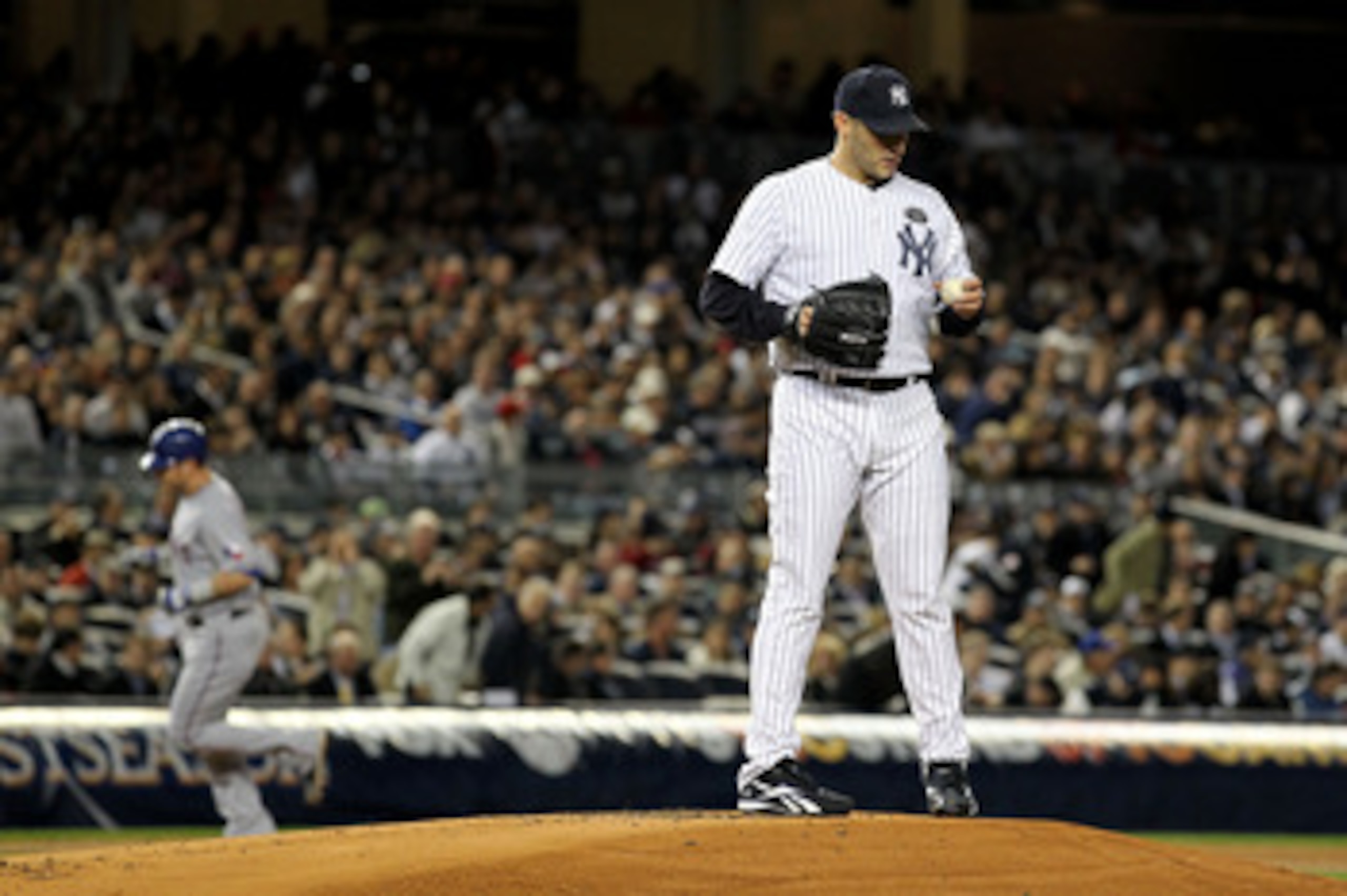 NEW YORK - OCTOBER 18:  Starting pitcher Andy Pettitte #46 of the New York Yankees reacts as Josh Hamilton #32 of the Texas Rangers rounds third base on his 2-run home tun in the top of the first inning of Game Three of the ALCS during the 2010 MLB Playof