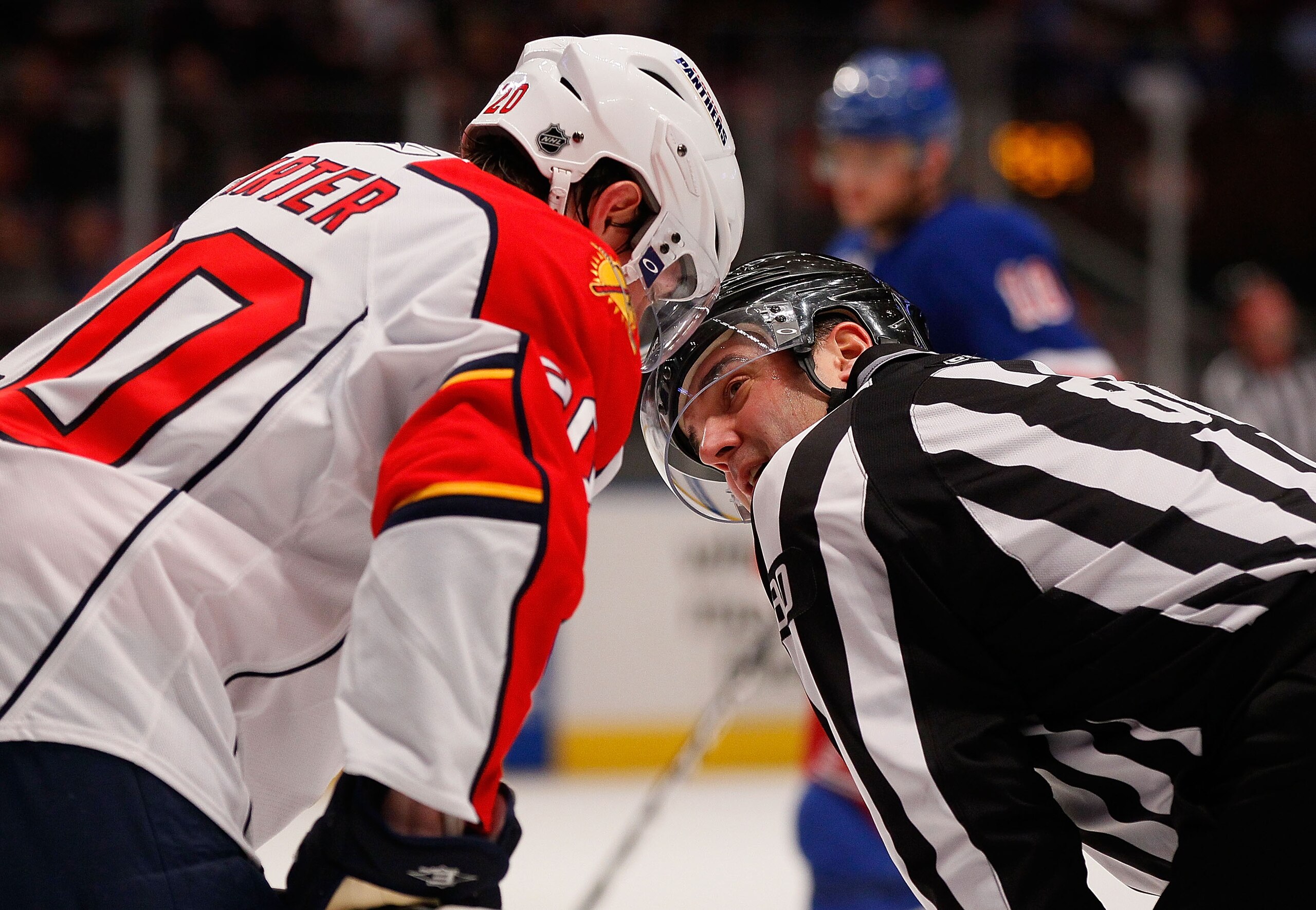 NEW YORK - MARCH 22:  Ryan Carter #20 of the Florida Panthers speks to linesman Thor Nelson #80 during the game against the New York Rangers on March 22, 2011 at Madison Square Garden in New York City, New York. Rangers defeated the Islanders 1-0.  (Photo