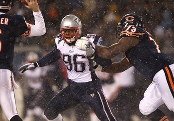 CHICAGO, IL - DECEMBER 12: Jermaine Cunningham #96 of the New England Patriots rushes past J'Marcus Webb #73 of the Chicago Bears towards Jay Cutler #6 at Soldier Field on December 12, 2010 in Chicago, Illinois. The Patriots defeated the Bears 36-7. (Phot