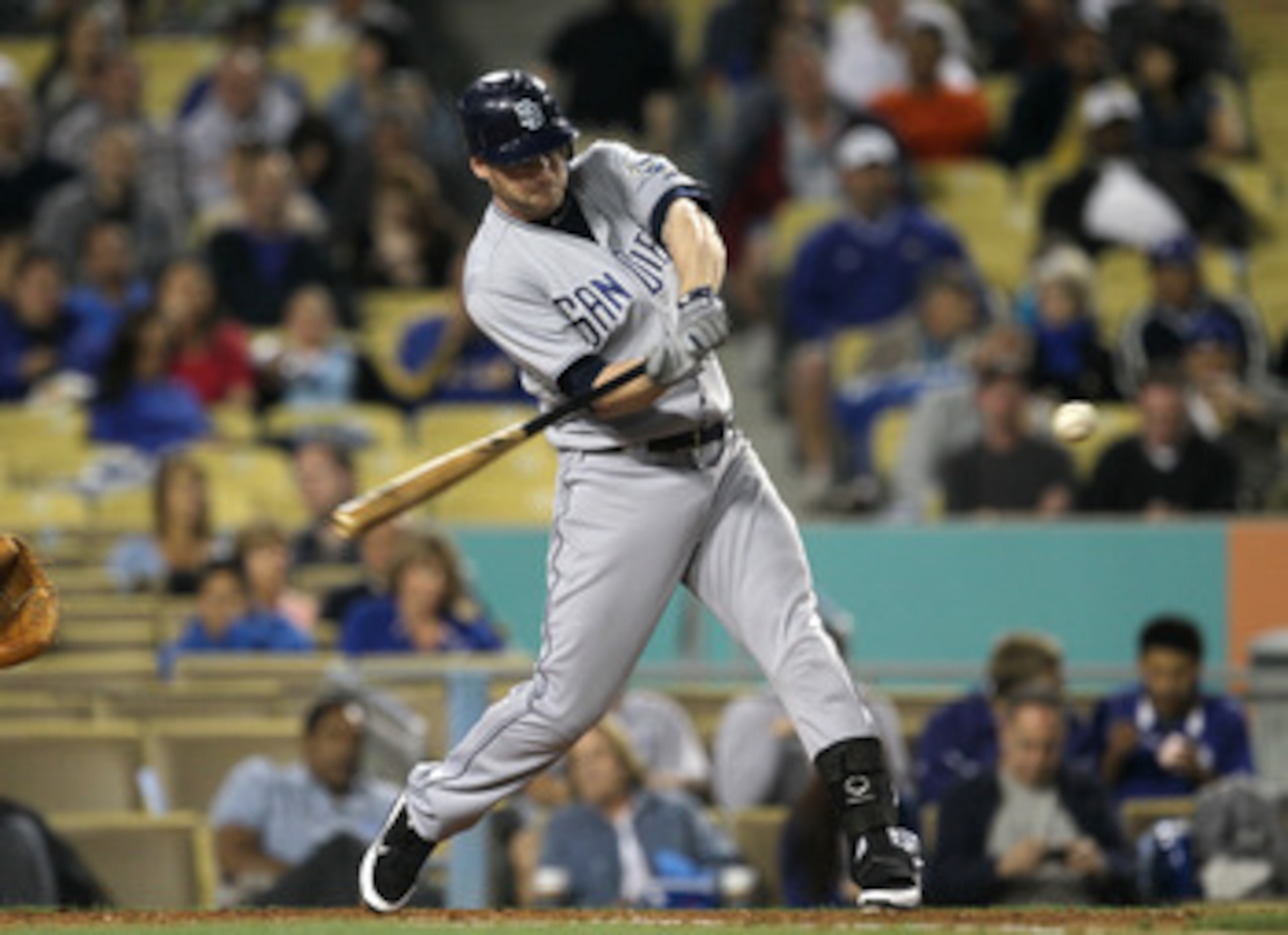 LOS ANGELES - APRIL 29:  Chase Headley #7 of the San Diego Padres  hits a double in the third inning against the Los Angeles Dodgers on April 29, 2011 at Dodger Stadium in Los Angeles, California.  (Photo by Stephen Dunn/Getty Images)