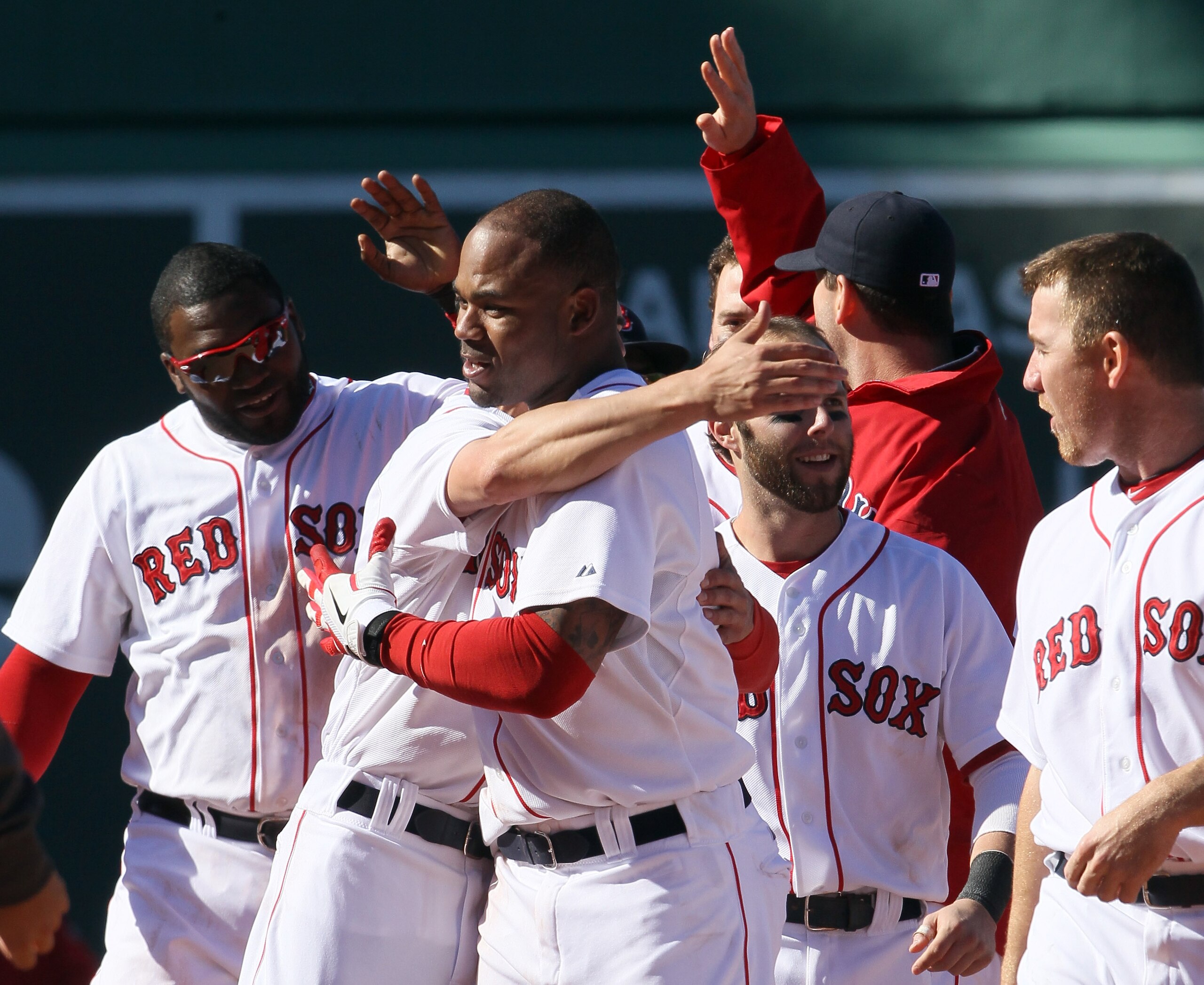 BOSTON, MA - MAY 01: Carl Crawford #13 of the Boston Red Sox is congratulated by teammates Jacoby Ellsbury #2 and David Ortiz #34 after Crawford drove in the game winning run in the bottom of the ninth inning against the Seattle Mariners on May 1, 2011 a BOSTON, MA - MAY 01: Carl Crawford #13 of the Boston Red Sox is congratulated by teammates Jacoby Ellsbury #2 and David Ortiz #34 after Crawford drove in the game winning run in the bottom of the ninth inning against the Seattle Mariners on May 1, 2011 a