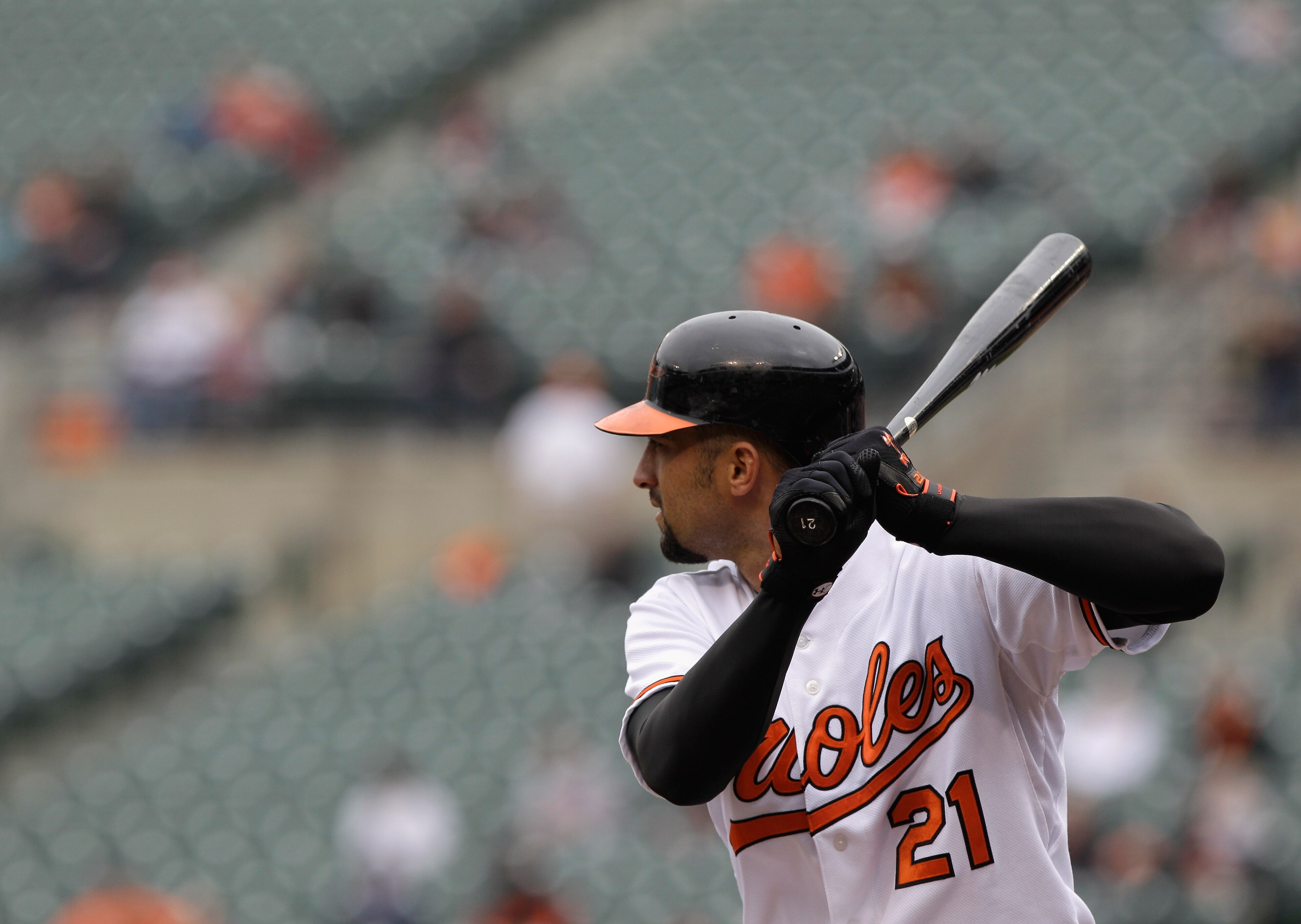 BALTIMORE, MD - APRIL 10: Nick Markakis #21 of the Baltimore Orioles at the plate against the Texas Rangers at Oriole Park at Camden Yards on April 10, 2011 in Baltimore, Maryland.  (Photo by Rob Carr/Getty Images)