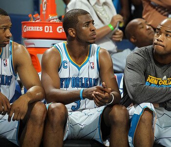 NEW ORLEANS, LA - APRIL 28:  (L-R) Willie Green #33, Chris Paul #3 and Jarrett Jack #2 of the New Orleans Hornets react on the bench during a 98-80 loss against the Los Angeles Lakers in Game Six of the Western Conference Quarterfinals in the 2011 NBA Pla