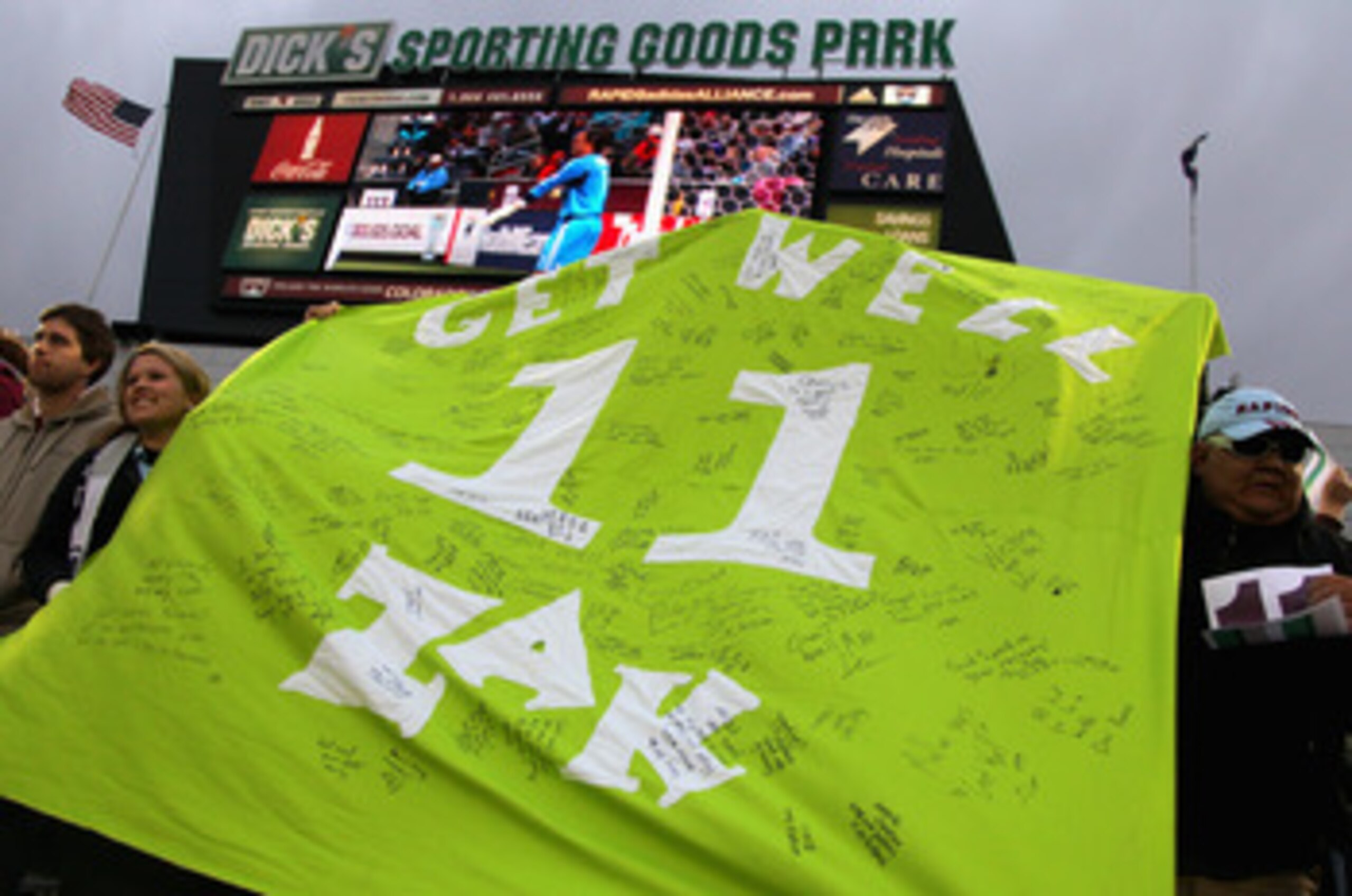 COMMERCE CITY, CO - APRIL 30:  Fans hoist a green banner with the #11 on them during the 11th minute of action between the Colorado Rapids and the Chicago Fire at Dick's Sporting Goods Park on April 30, 2011 in Commerce City, Colorado. The banner bearig '