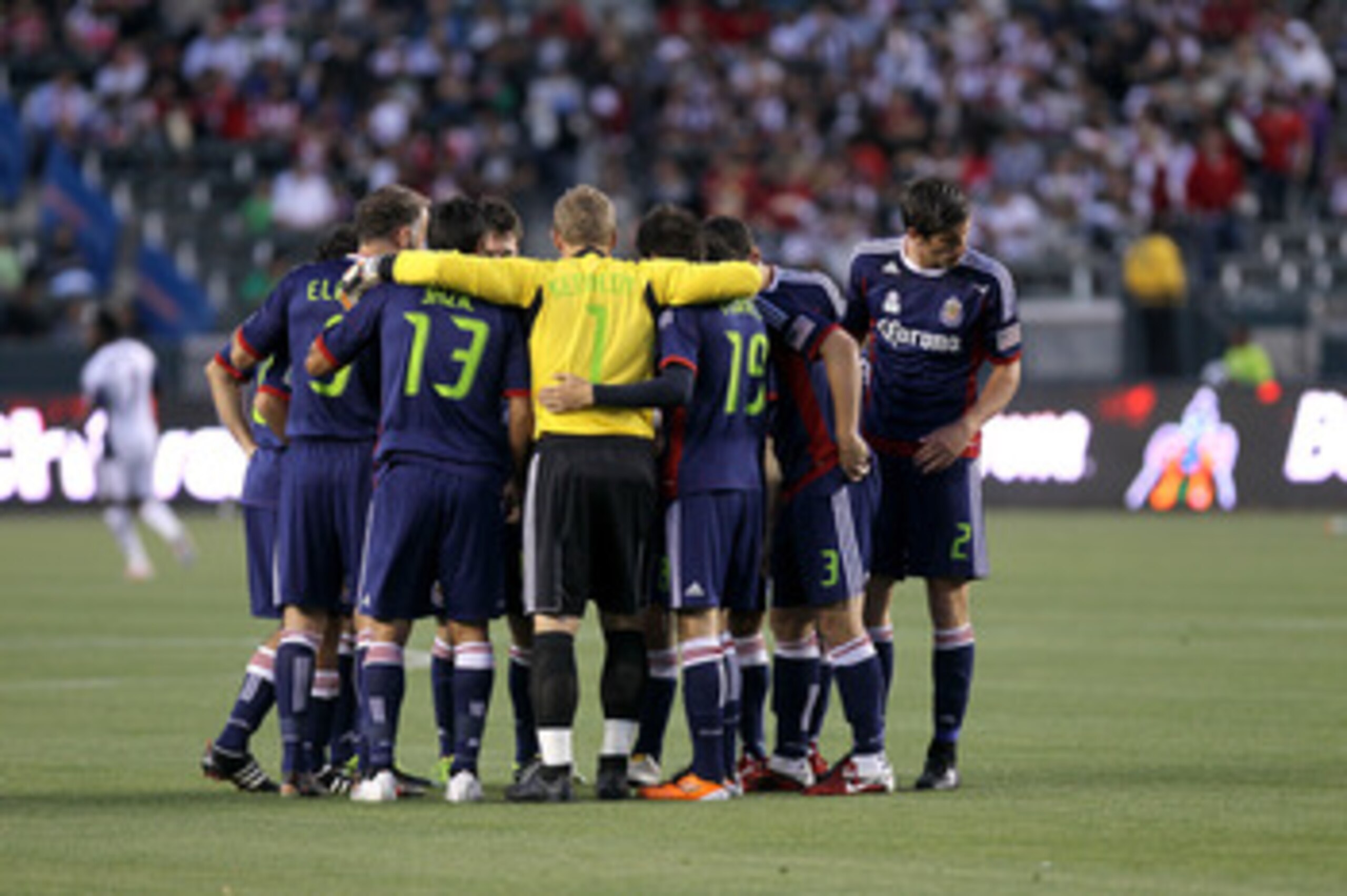 CARSON, CA - APRIL 30:   The Chivas USA starting 11 huddle before the game with the New England Revolution at The Home Depot Center on April 30, 2011 in Carson, California.  Chivas USA won 3-0.   (Photo by Stephen Dunn/Getty Images)
