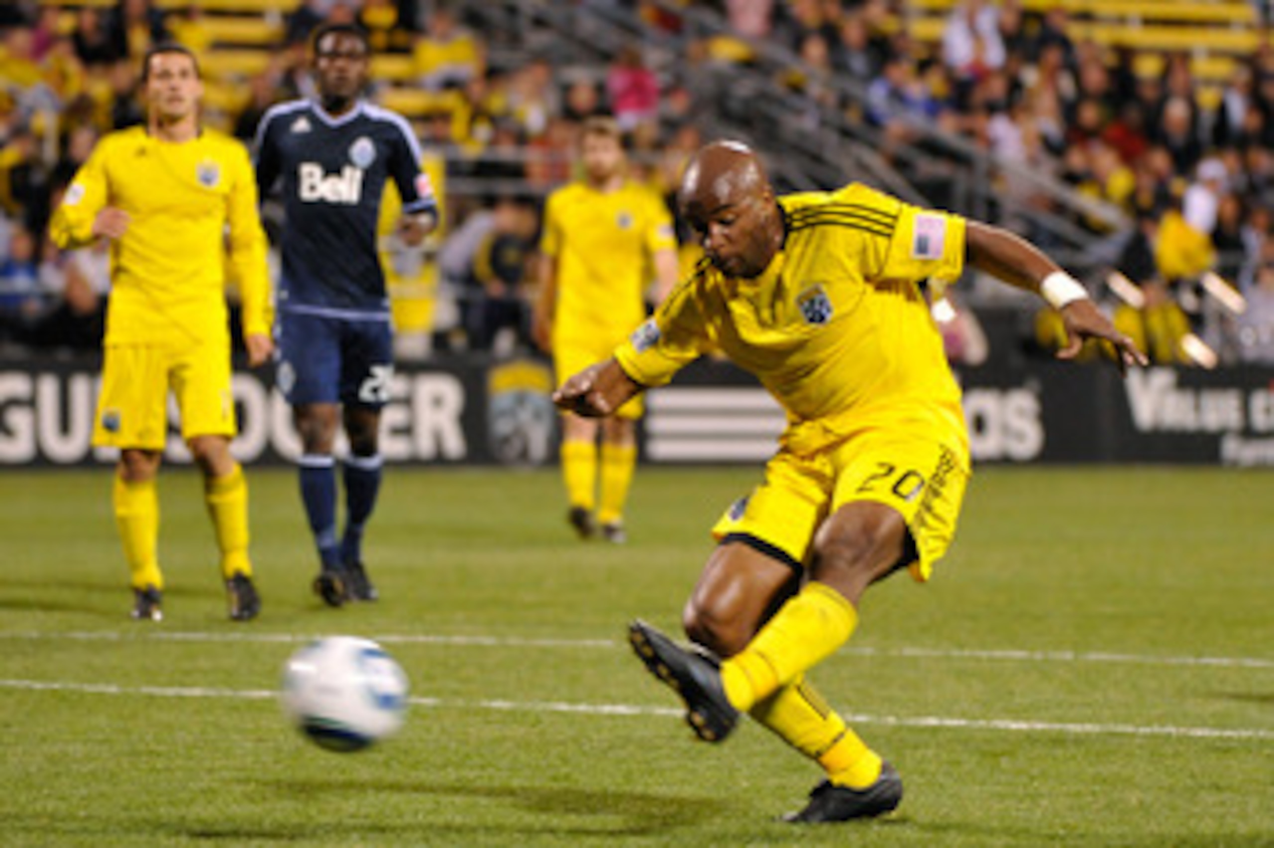 COLUMBUS, OH - APRIL 30:  Emilio Renteria #20 of the Columbus Crew connects on a shot for his second goal against the Vancouver Whitecaps FC in the second half on April 30, 2011 at Crew Stadium in Columbus, Ohio. Columbus defeated Vancouver 2-1.  (Photo b