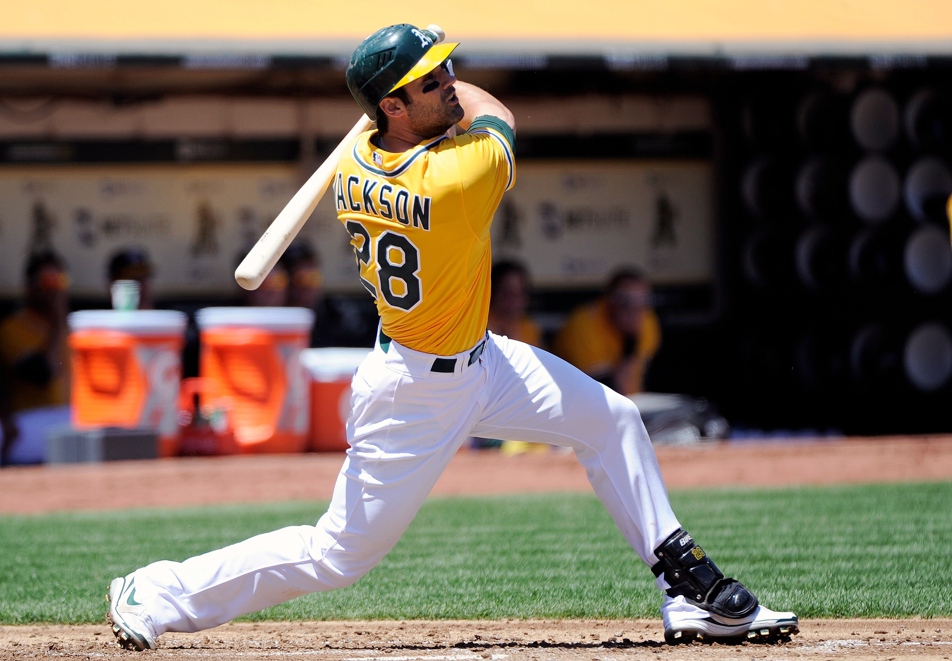 OAKLAND, CA - MAY 1: Conor Jackson #28 of the Oakland Athletics hits a double to drive in two runs in the bottom of the first inning against the Texas Rangers during a MLB baseball game at the Oakland-Alameda County Coliseum May 1, 2011 in Oakland, Califo
